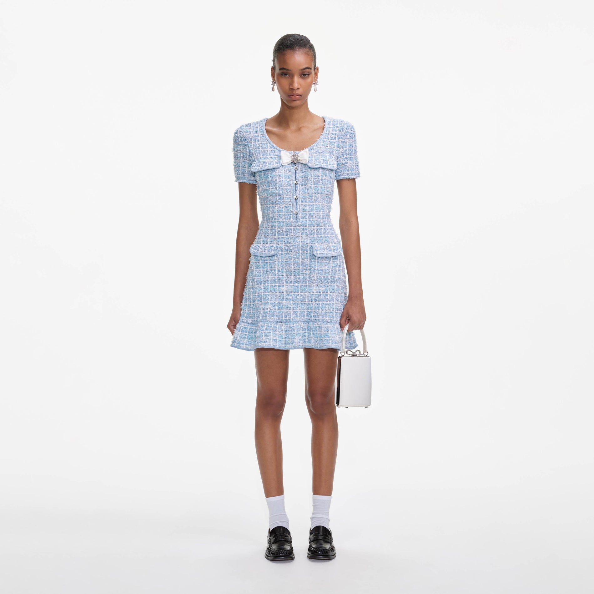 Front view of a woman wearing the Blue Check Knit Mini Dress