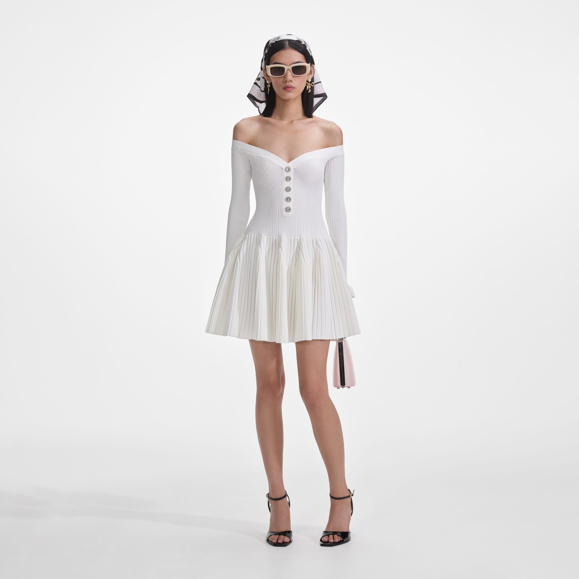 Front view of a woman wearing the White Ribbed Knit Mini Dress