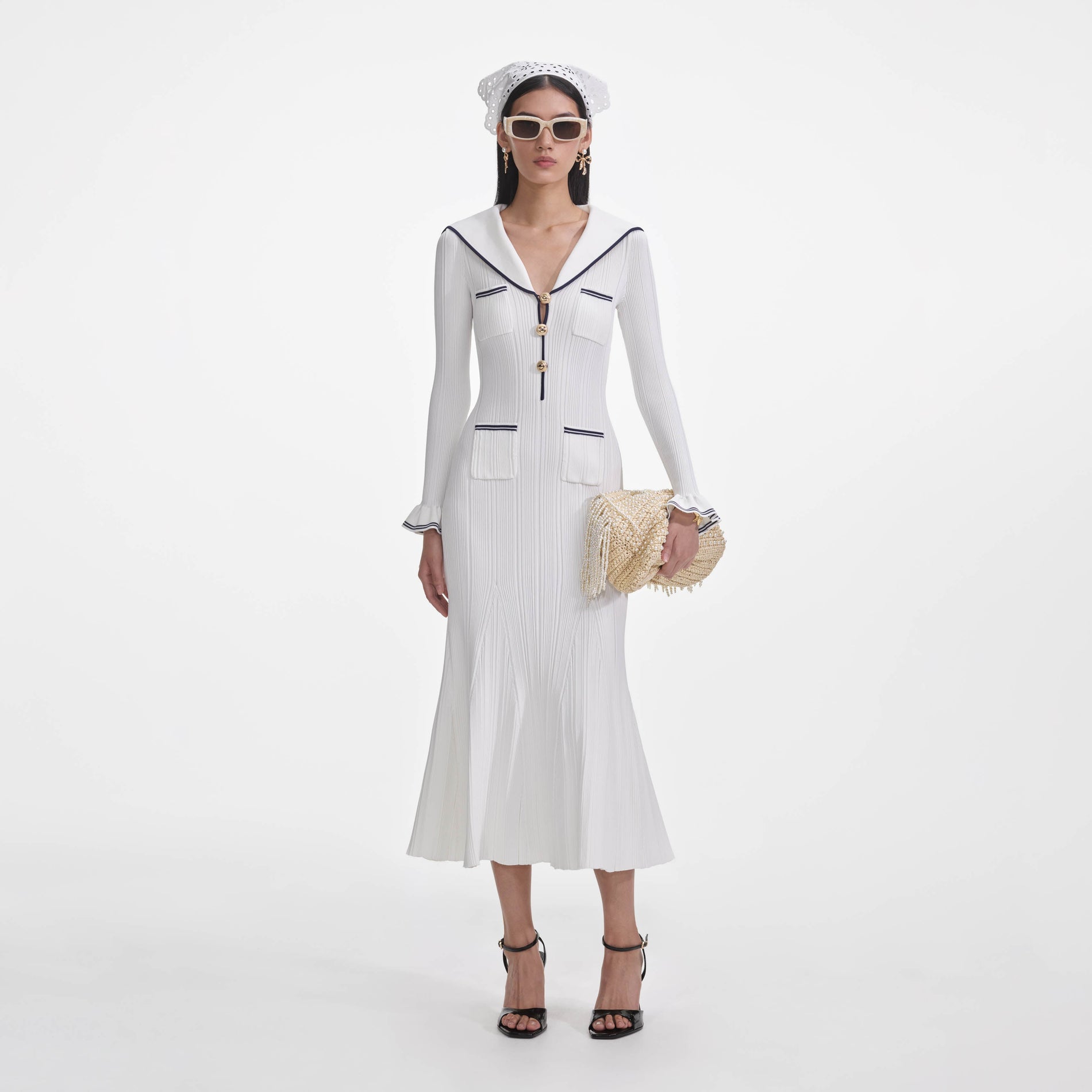 Front view of a woman wearing the White Viscose Rib Knit Midi Dress