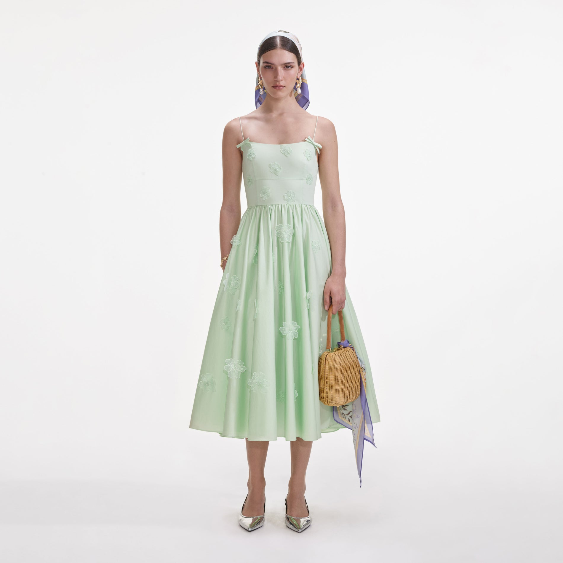 Front view of a woman wearing the Green Cotton Flower Midi Dress