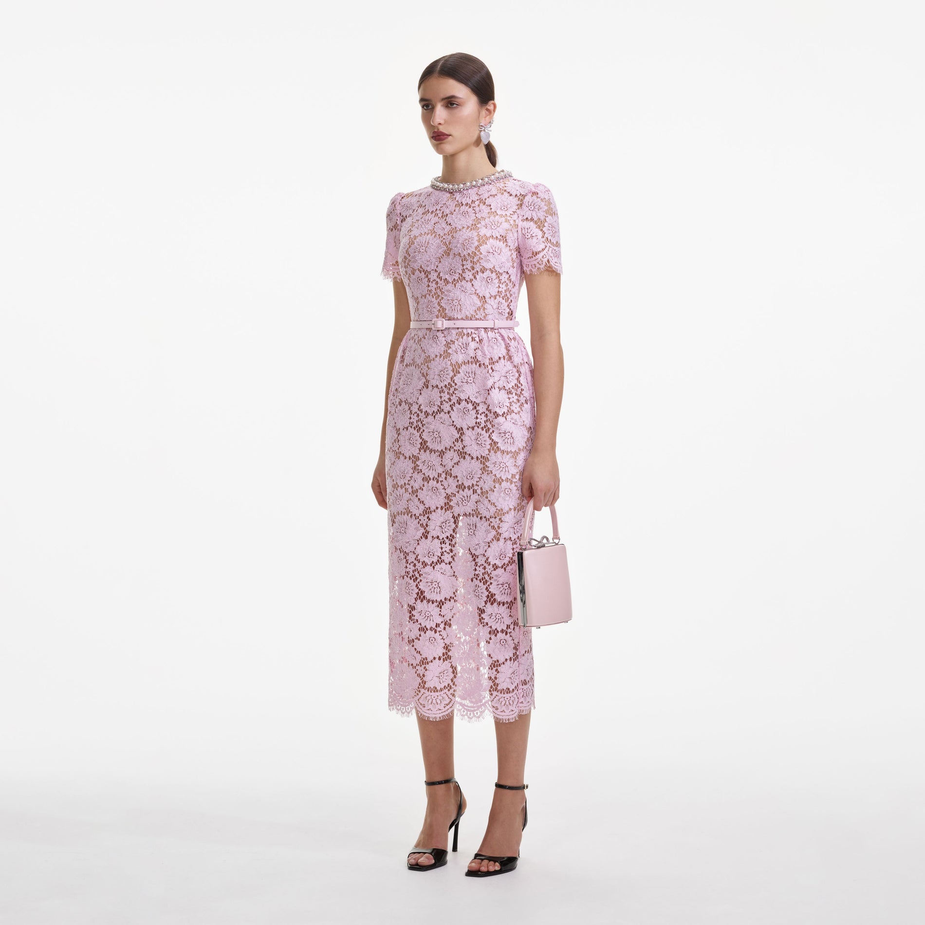 Side view of a woman wearing the Pink Fine Lace Pearl Midi Dress