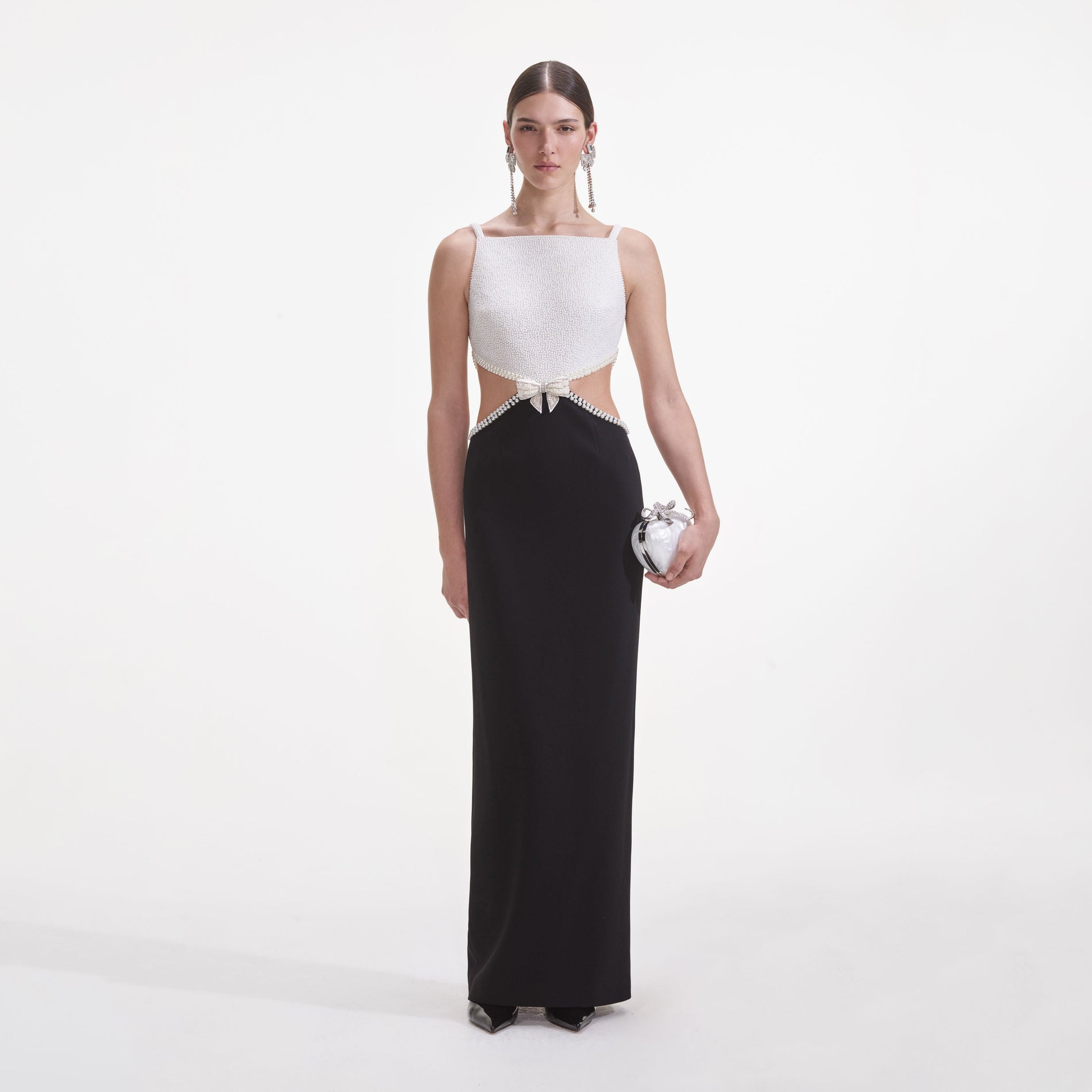 Front view of a woman wearing the Black And White Crepe Maxi Dress