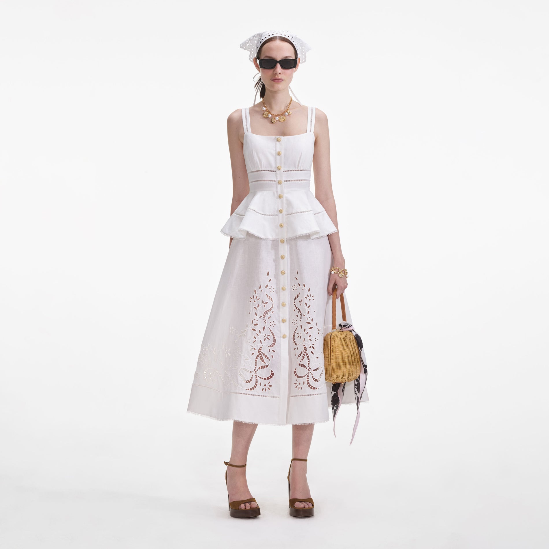 Front view of a woman wearing the Cream Linen Peplum Midi Dress