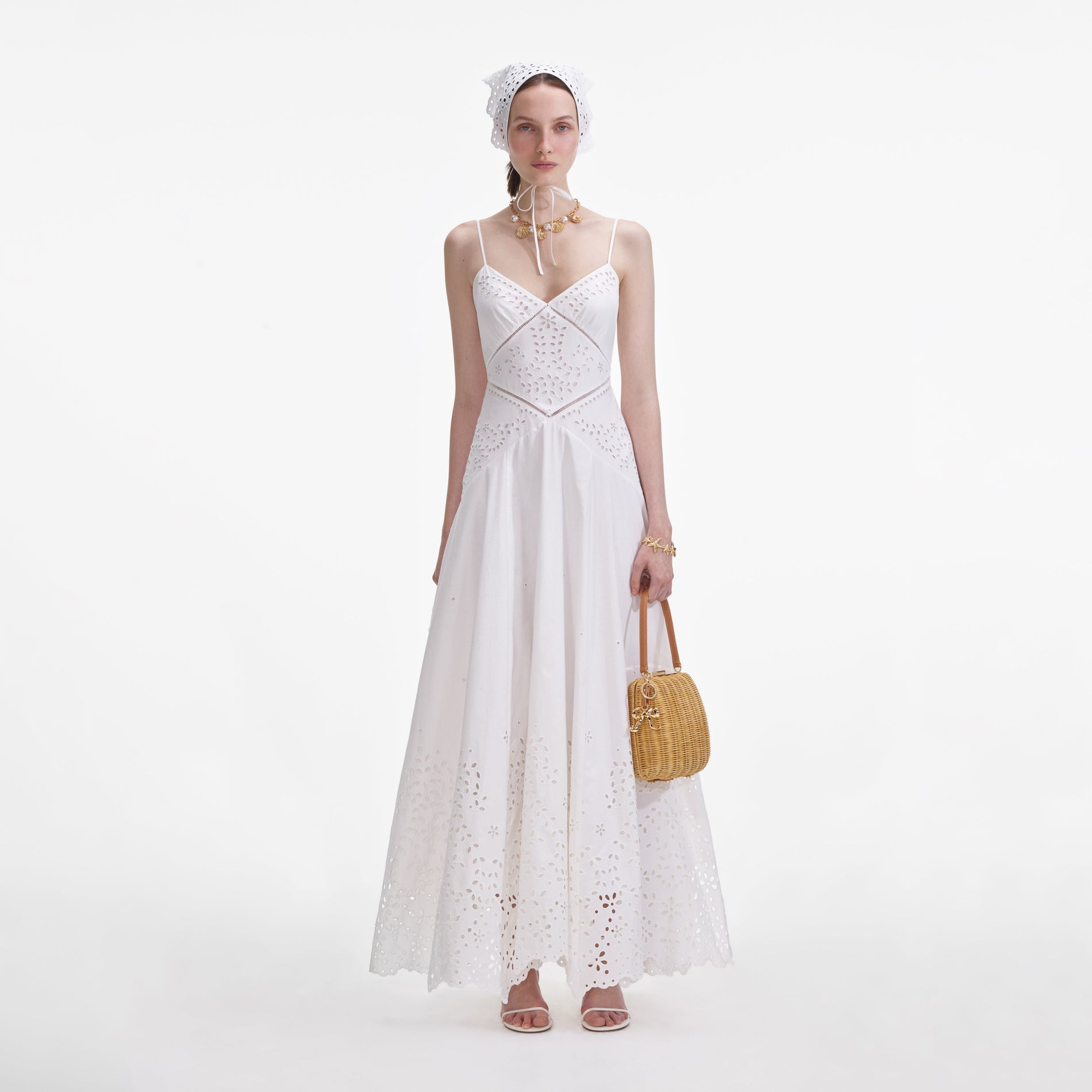 Front view of a woman wearing the White Cotton Embroidered Maxi Dress