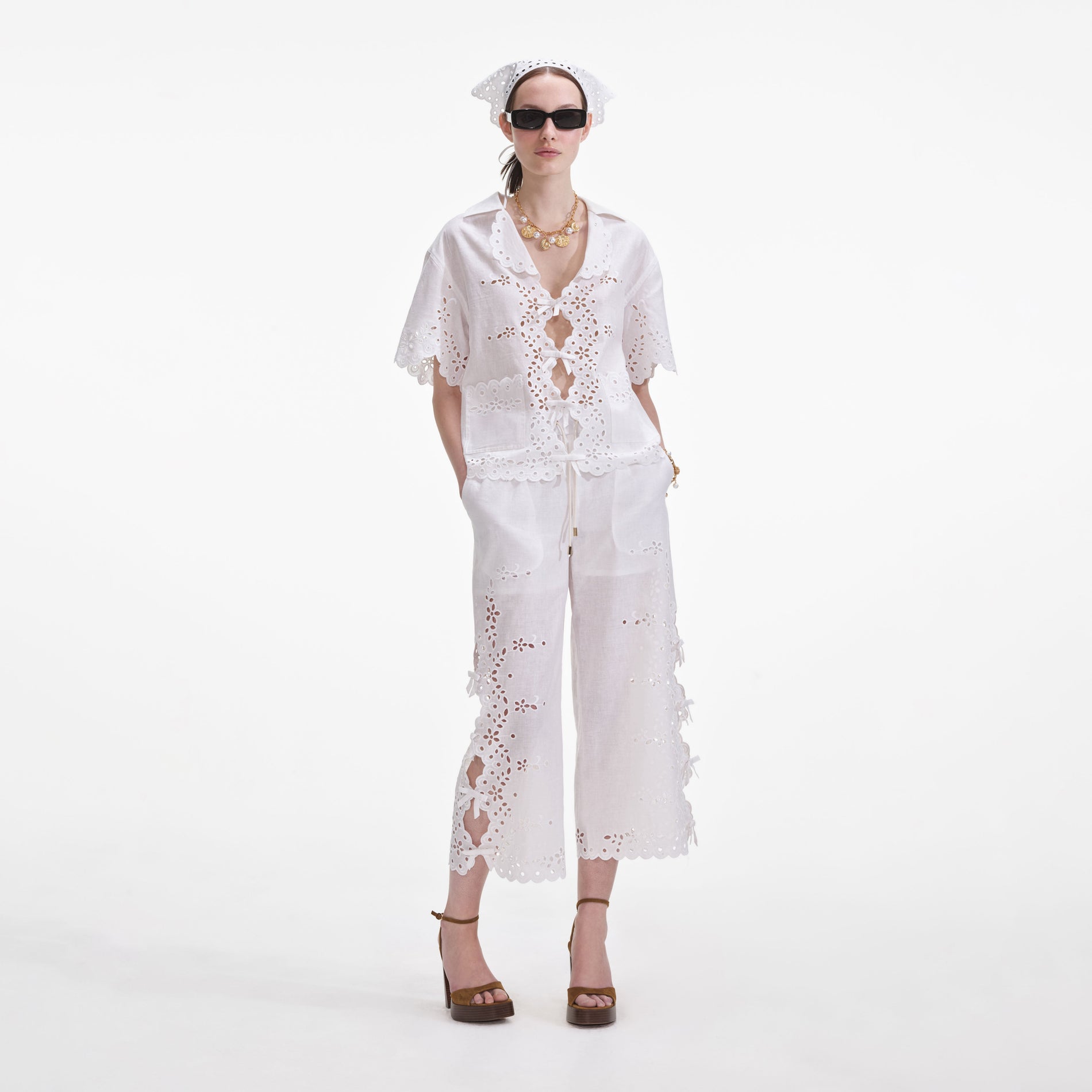 Front view of a woman wearing the Cream Linen Embroidered Shirt