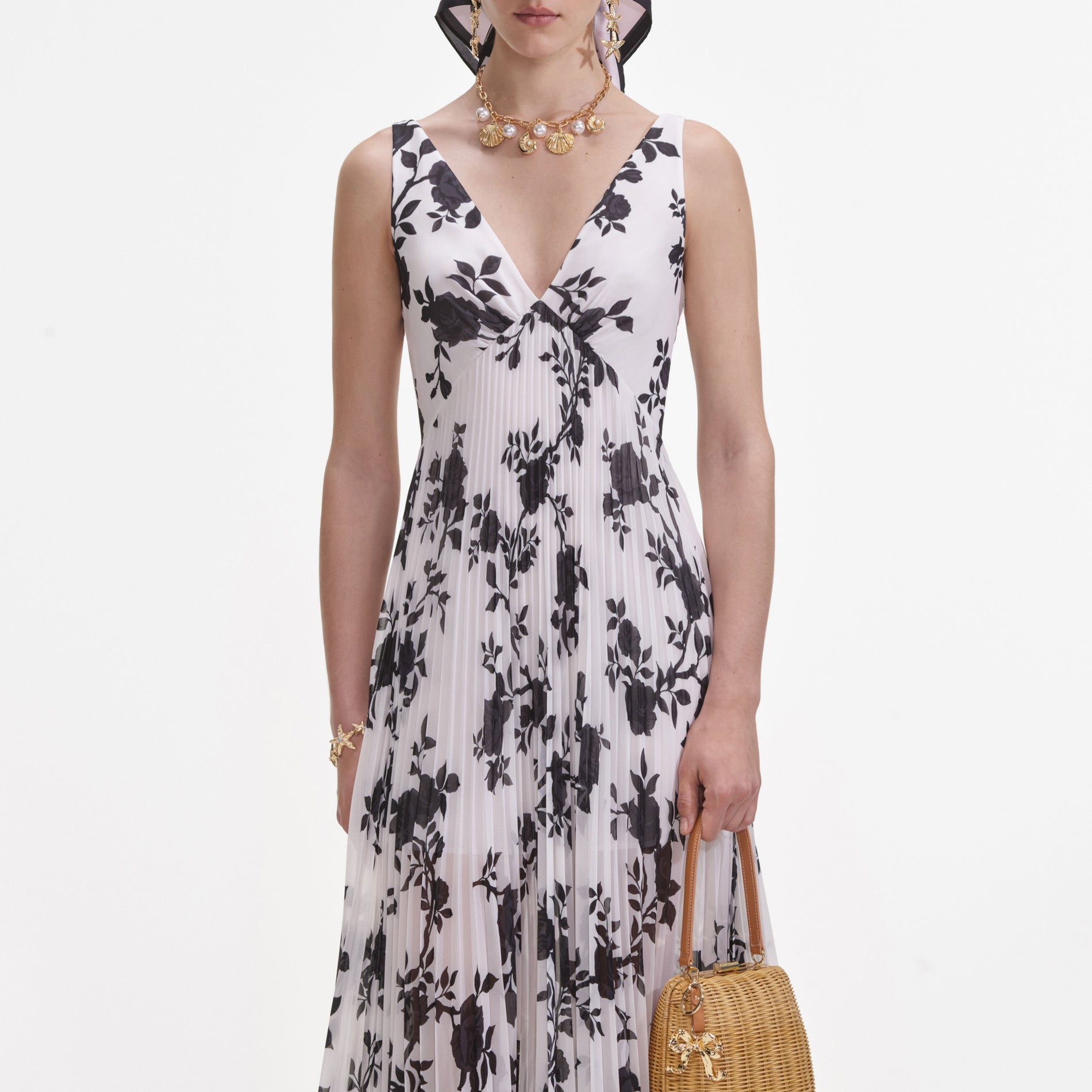 A close up of a woman wearing the Floral Print Chiffon Maxi Dress