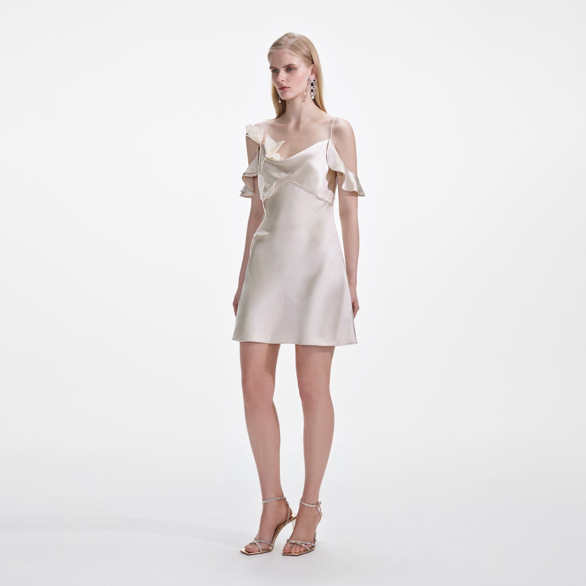 Side view of a woman wearing the Champagne Flower Satin Mini Dress