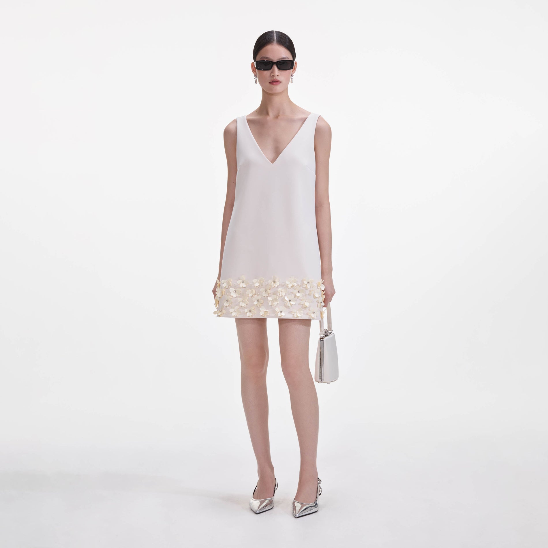 Front view of a woman wearing the Cream Crepe 3D Sequin Mini Dress