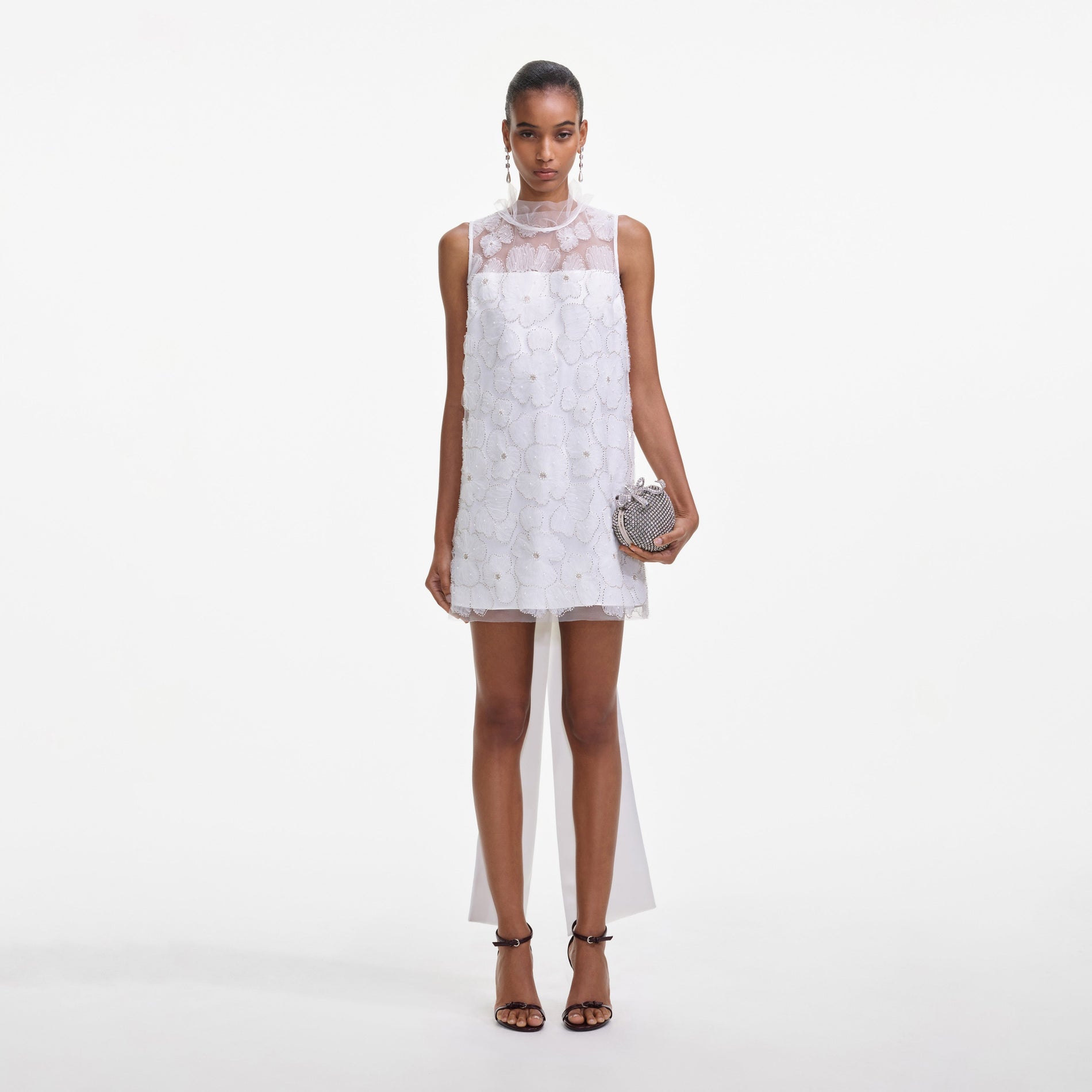 Front view of a woman wearing the White Tulle Satin Bow Mini Dress