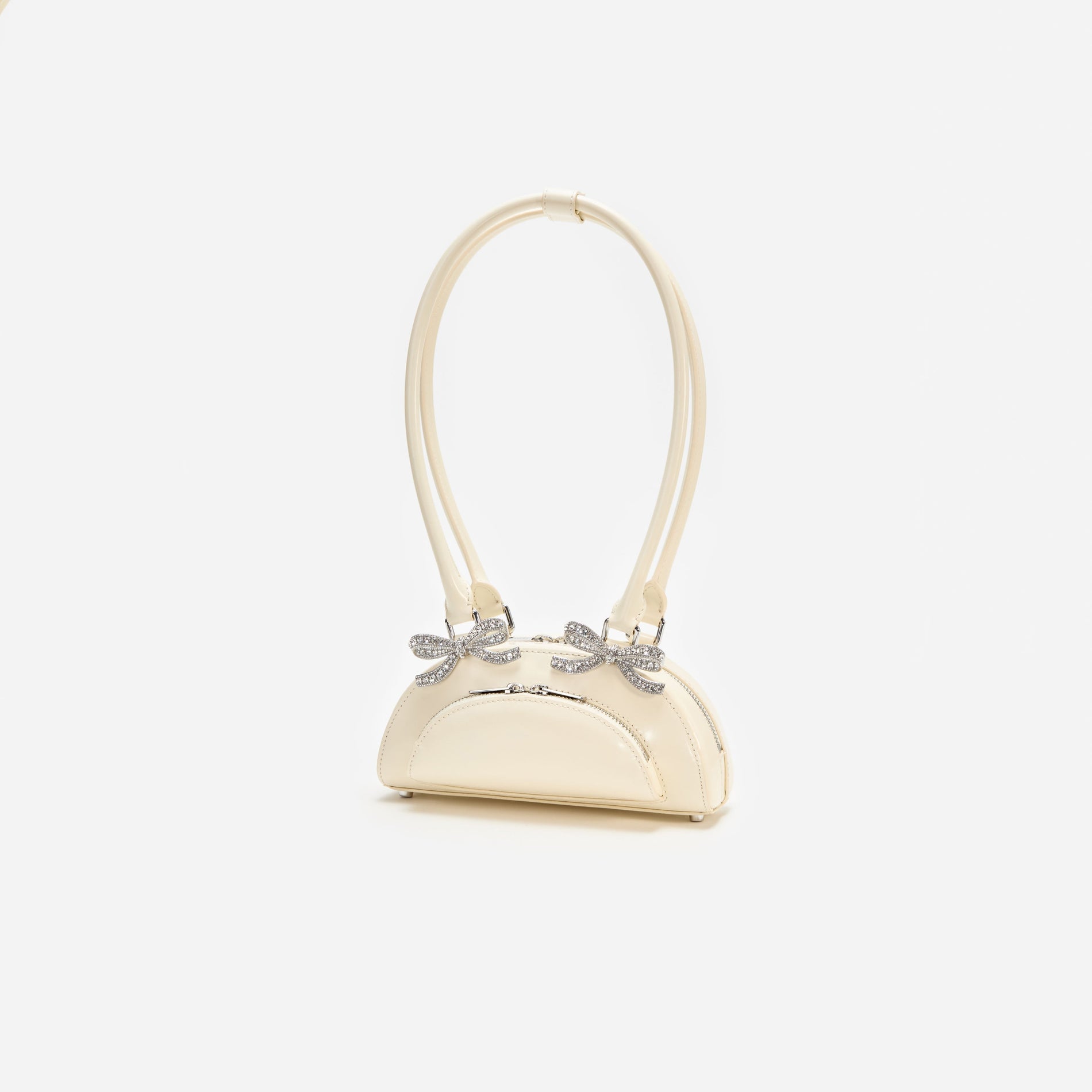 A photo of the Cream Leather Curved Mini Shoulder Bag