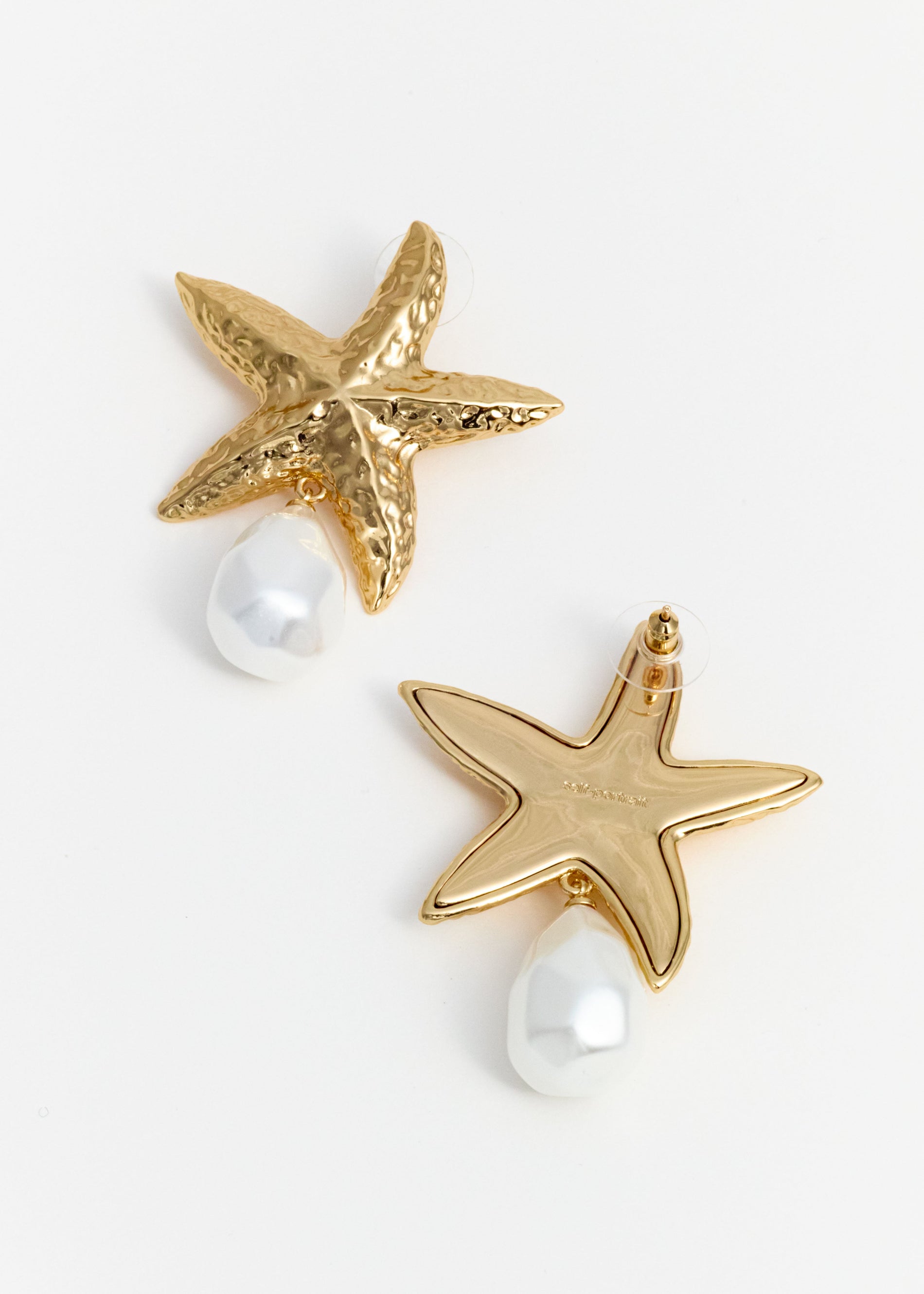 A photo of the Mottled Gold Sea Star Pearl Earrings