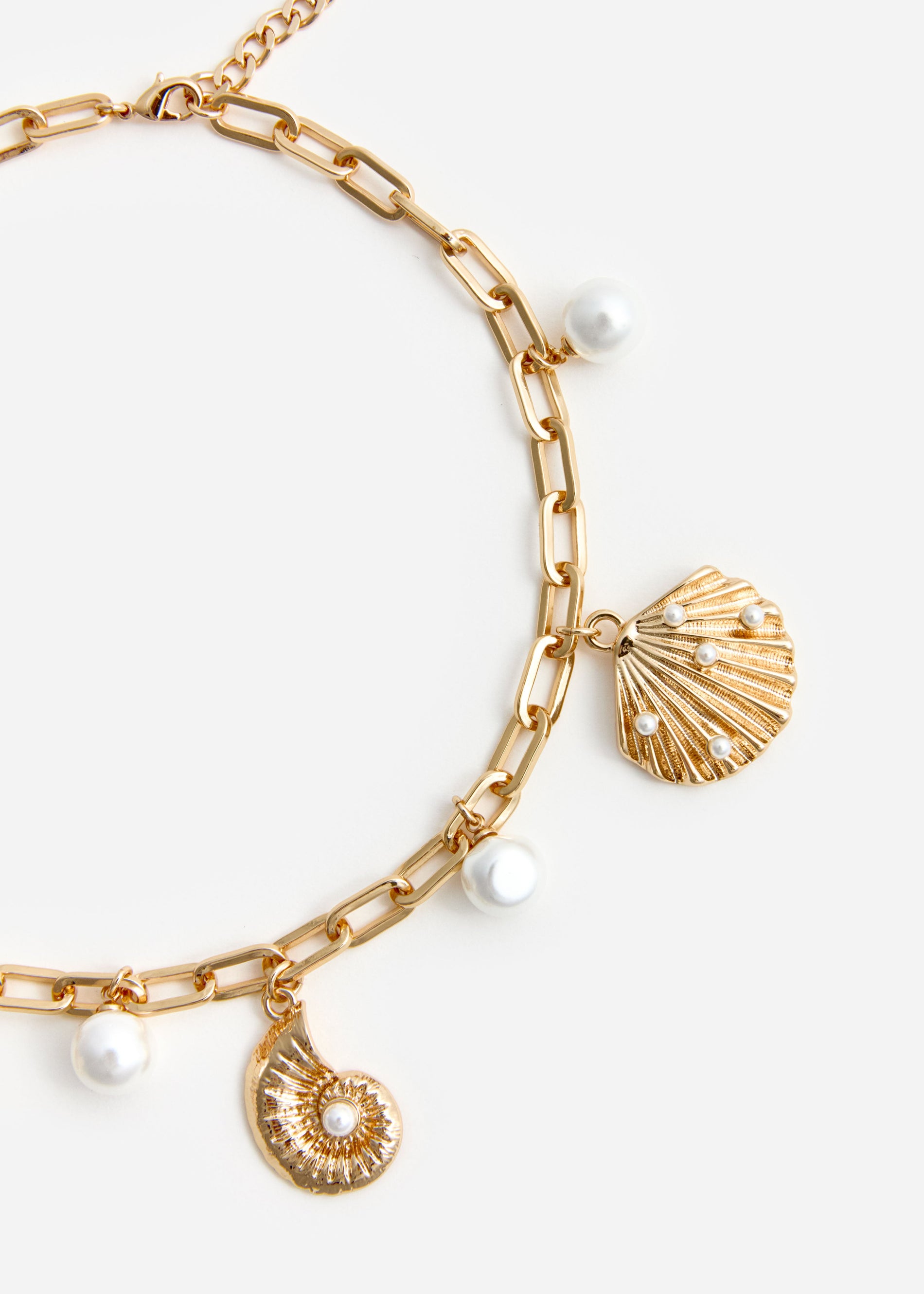 A photo of the Gold Pearl Shell Charm Necklace