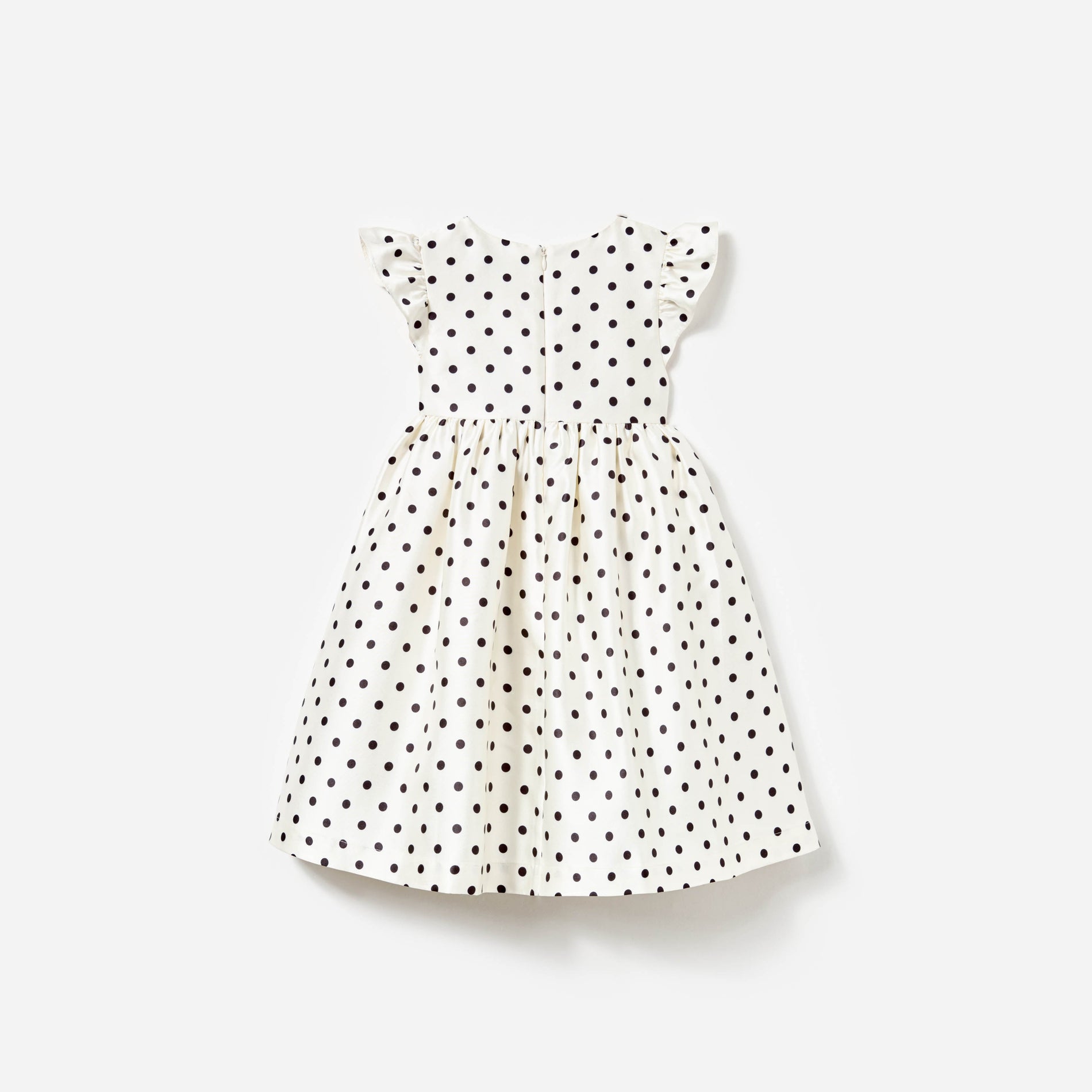 Side view of a woman wearing the Cream Polka Dot Taffeta Dress