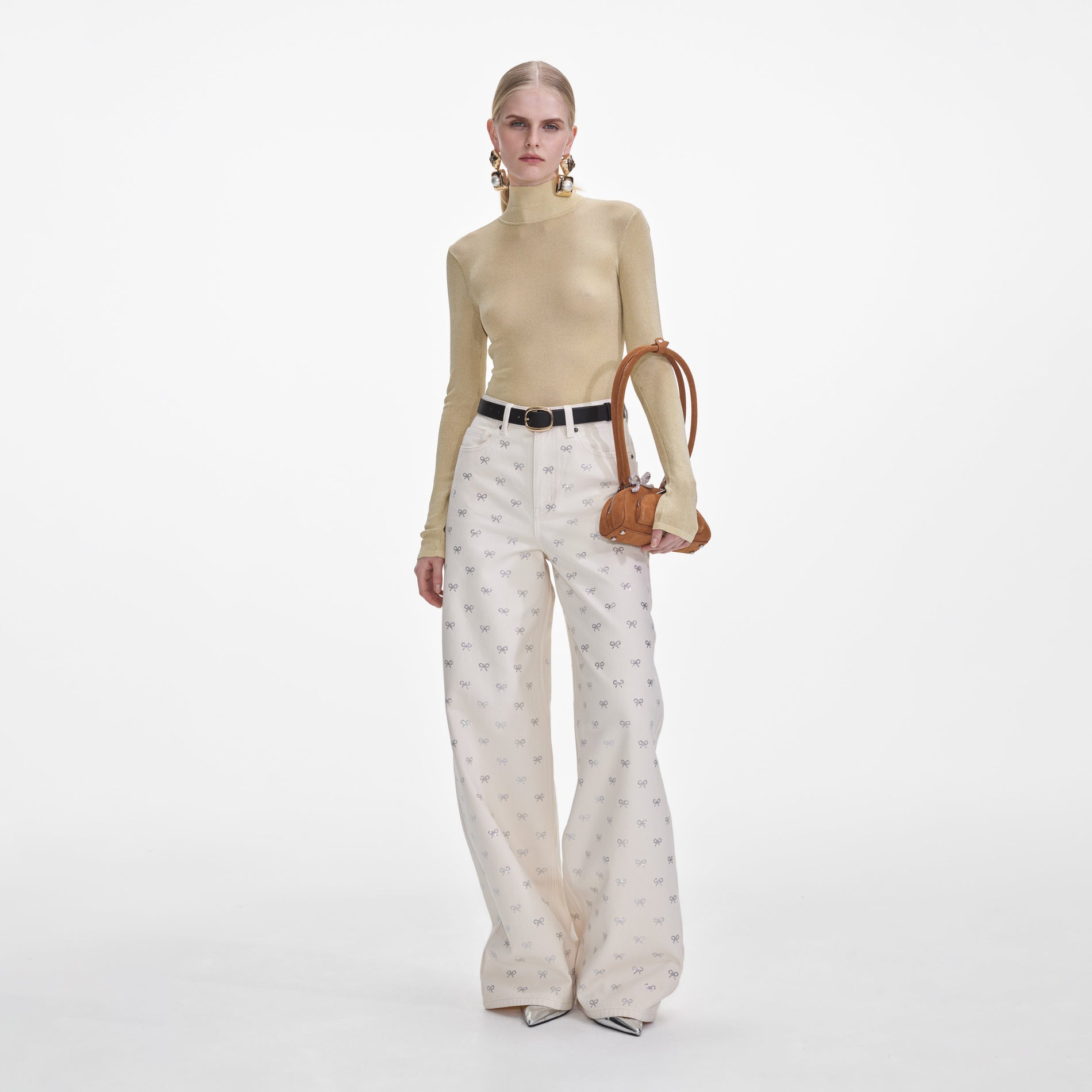 Front view of a woman wearing the Cream Denim Diamante Bow Jeans