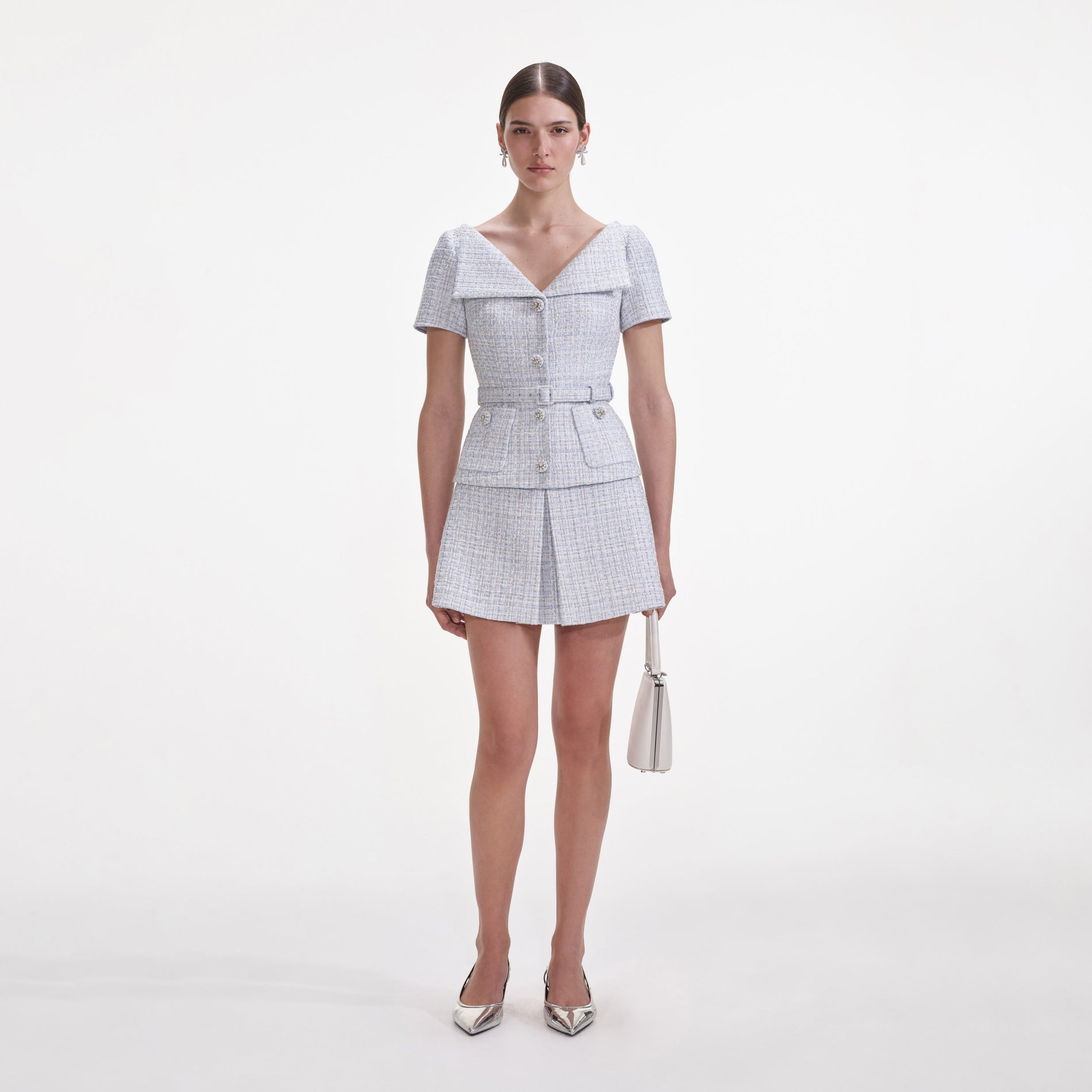 Front view of a woman wearing the Blue Boucle Top