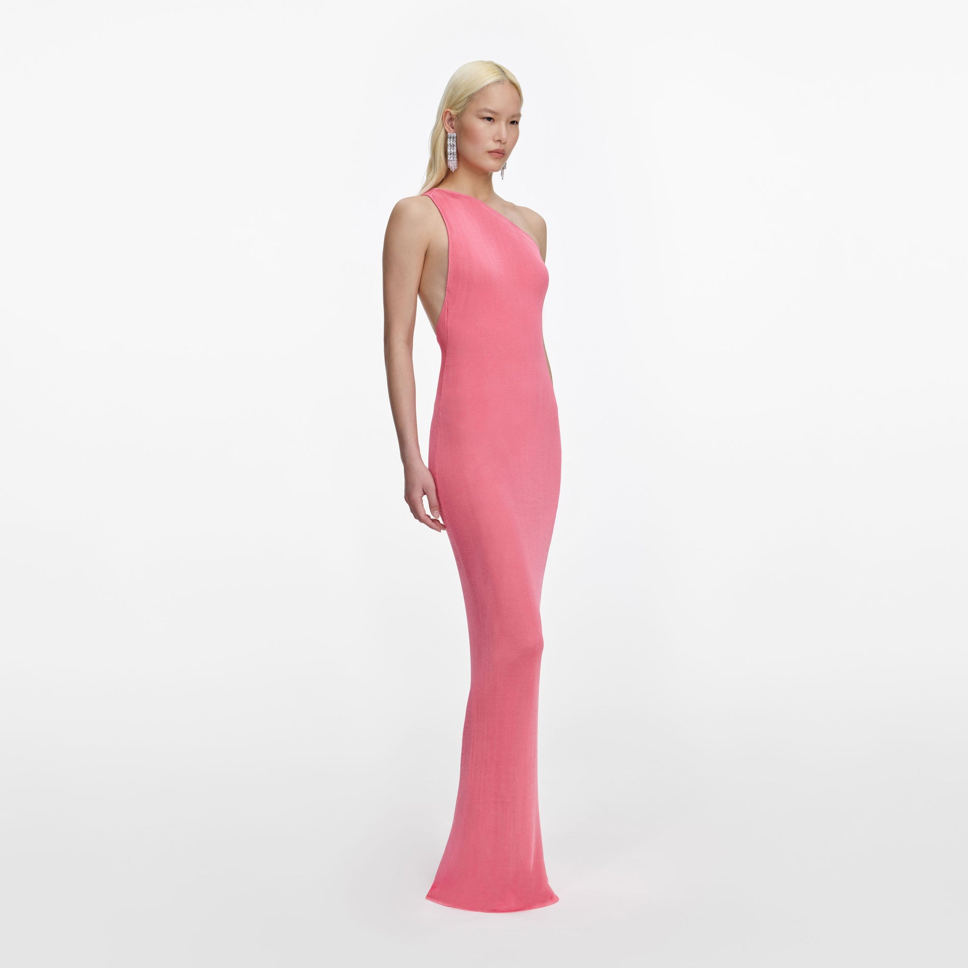 Side view of a woman wearing the Pink Viscose Knit One Shoulder Maxi Dress