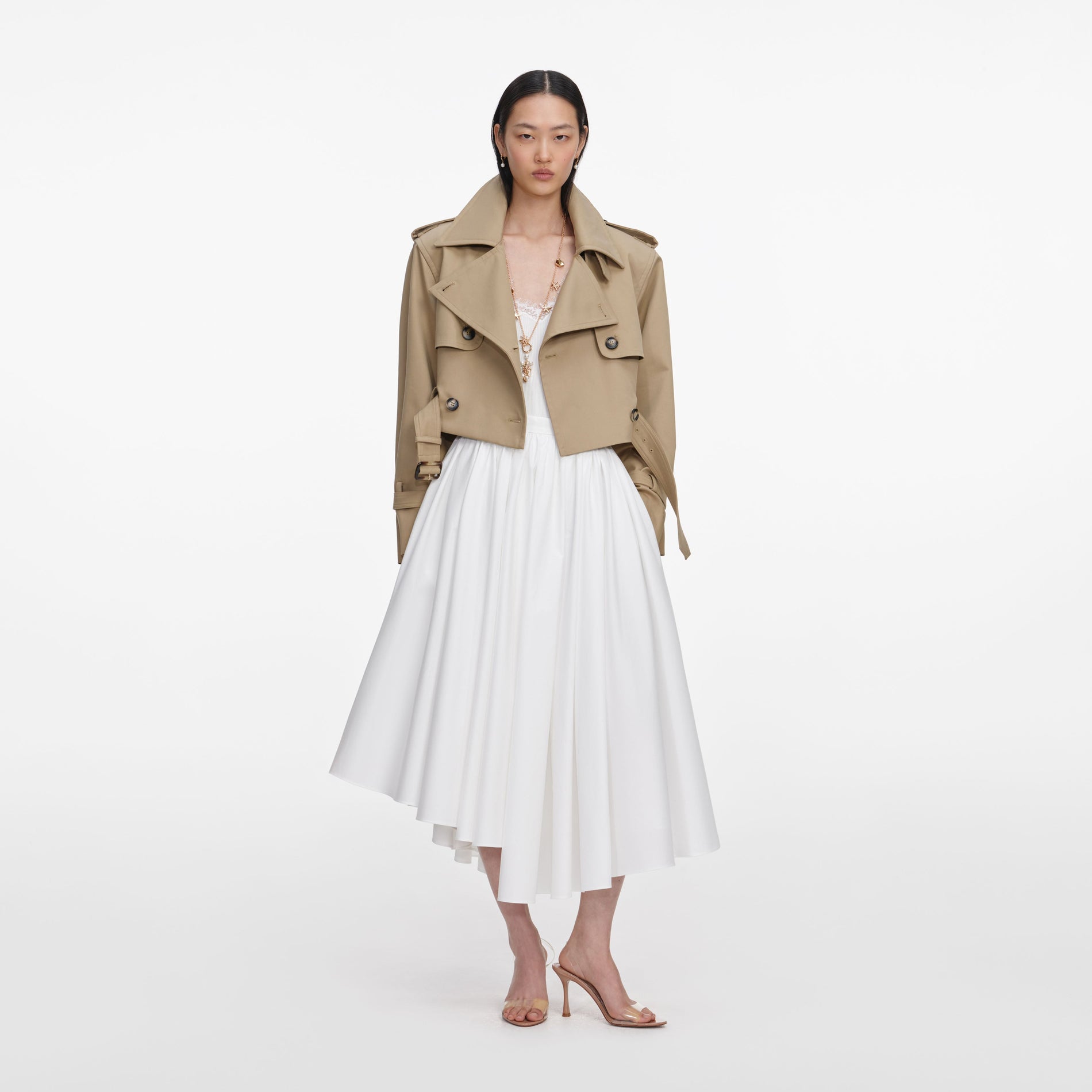 Front view of a woman wearing the Beige Cropped Trench Jacket
