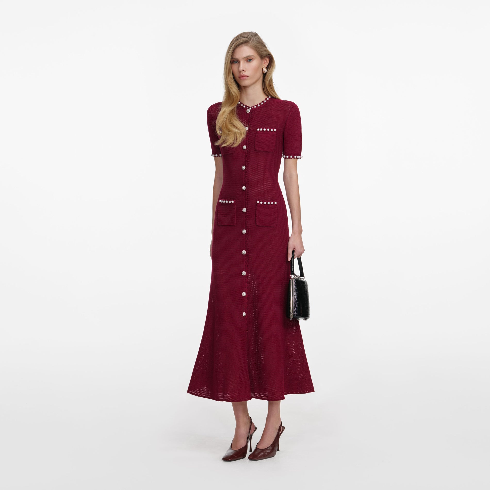 Side view of a woman wearing the Burgundy Pearl Knit Midi Dress