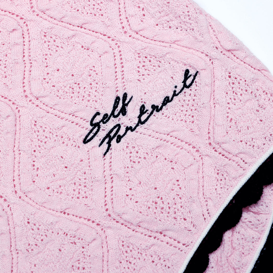 A close up of the fabric for the Pink Pointelle Knit Playsuit