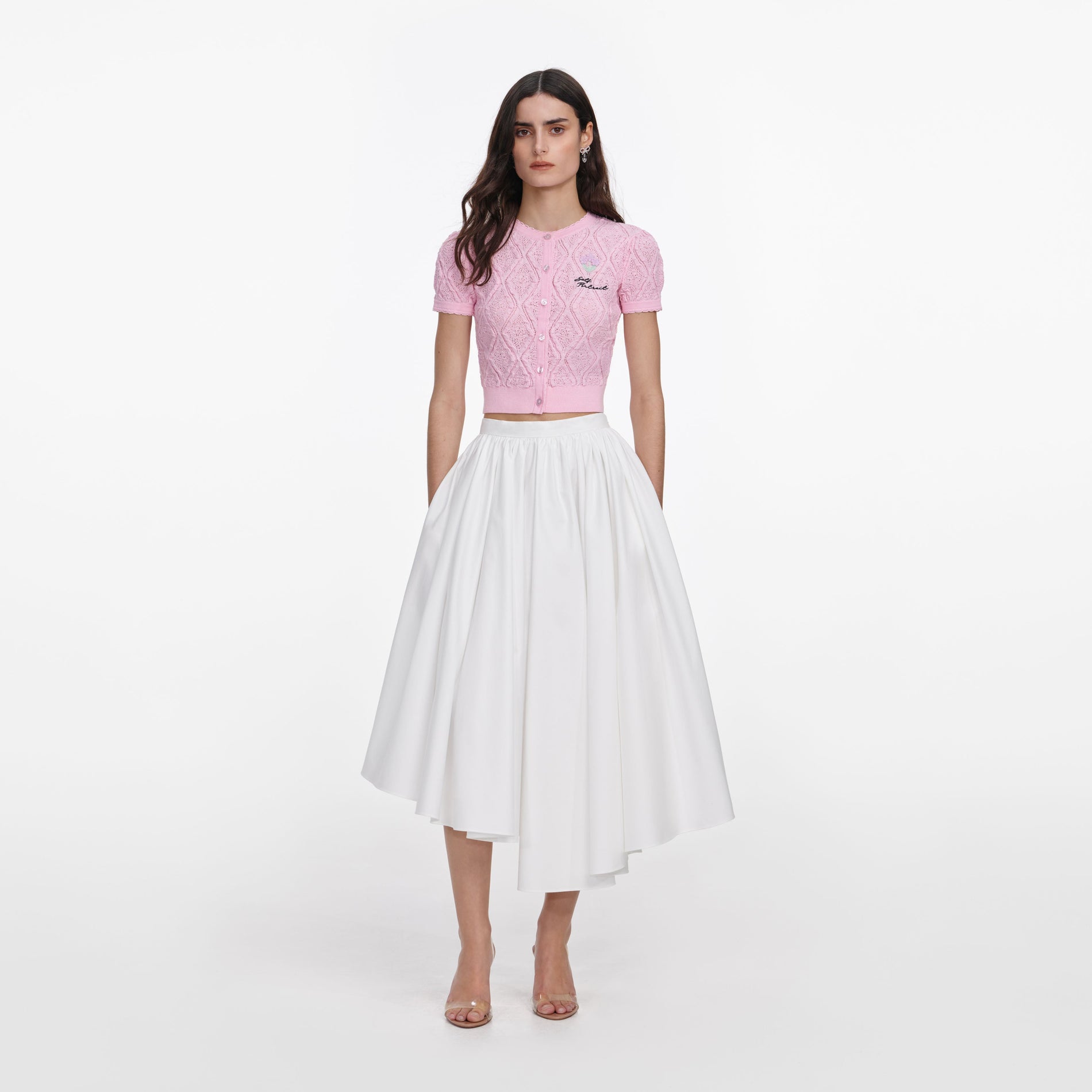 Front view of a woman wearing the Pink Pointelle Knit Top