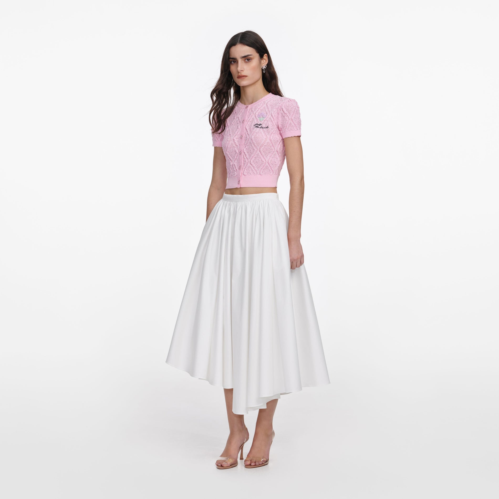 Side view of a woman wearing the Pink Pointelle Knit Top