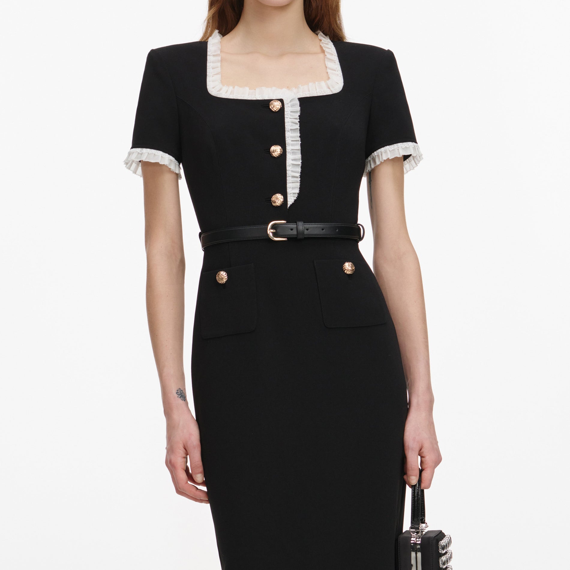 A close up of a woman wearing the Black Crepe Contrast Frill Midi Dress