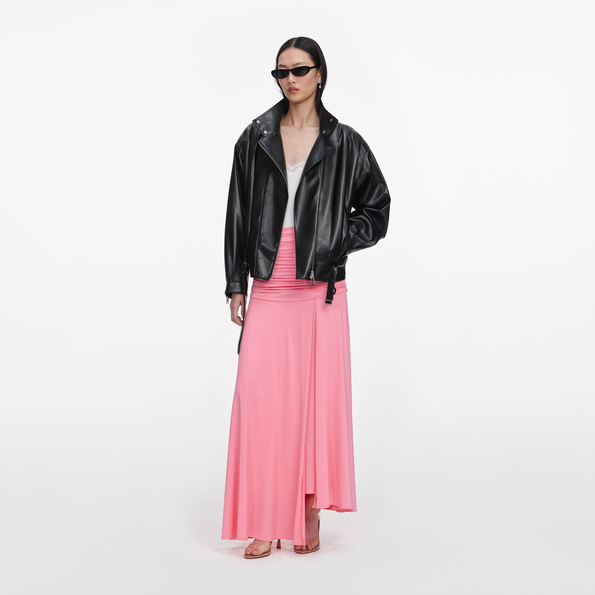 Side view of a woman wearing the Black Faux Leather Biker Jacket