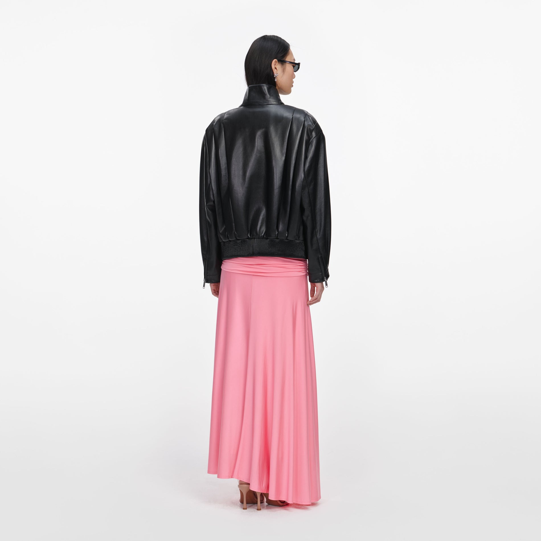 Back view of a woman wearing the Black Faux Leather Biker Jacket