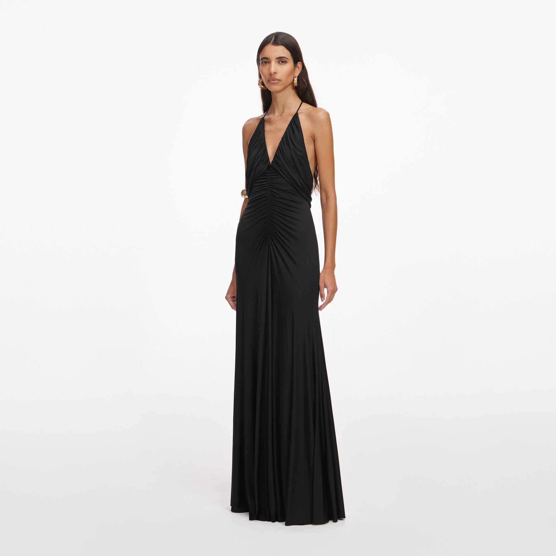 Side view of a woman wearing the Black Jersey Gathered Maxi Dress
