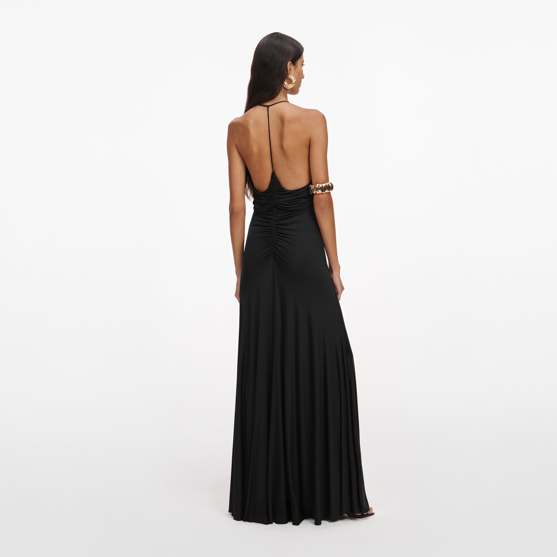 Back view of a woman wearing the Black Jersey Gathered Maxi Dress