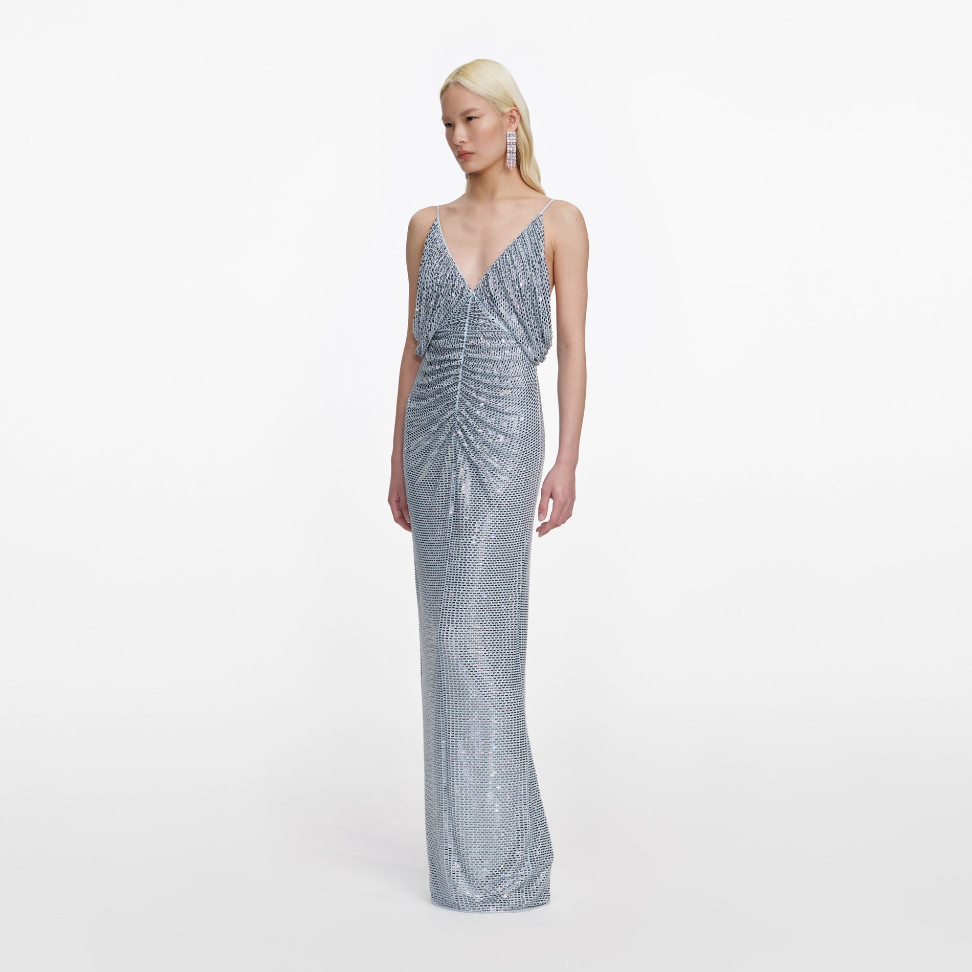 Side view of a woman wearing the Blue Rhinestone Mesh Maxi Dress