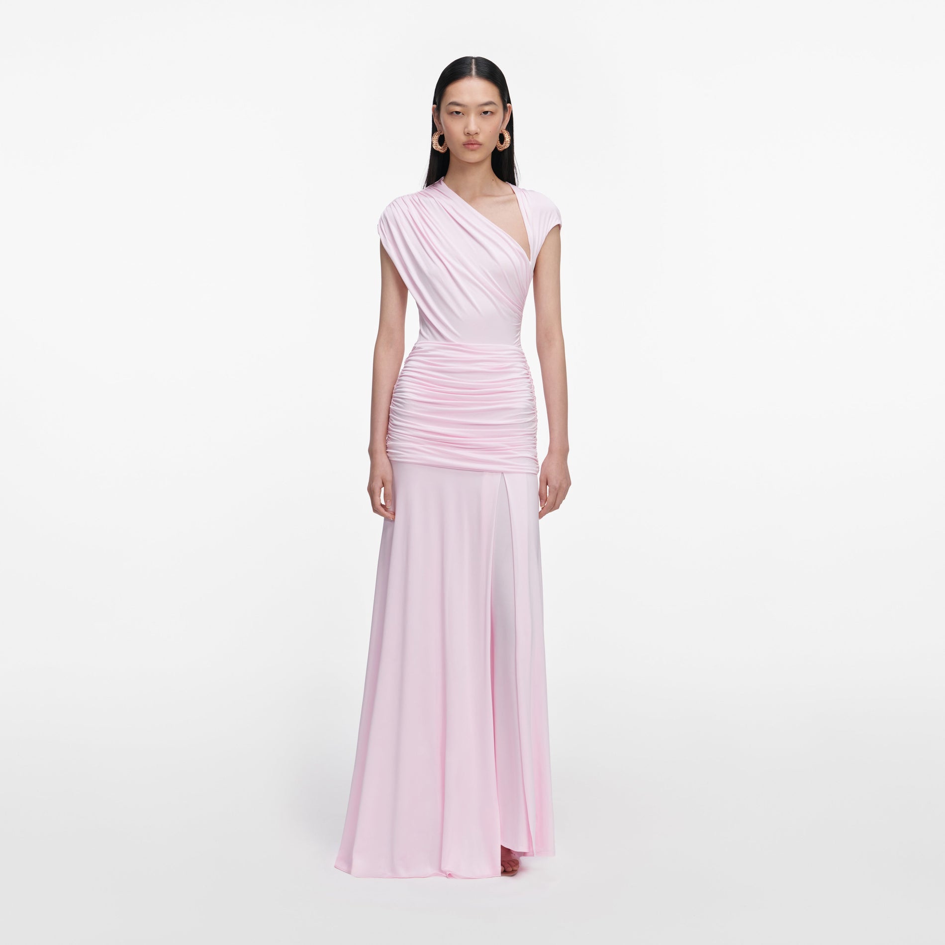 Front view of a woman wearing the Pink Jersey Draped Maxi Dress