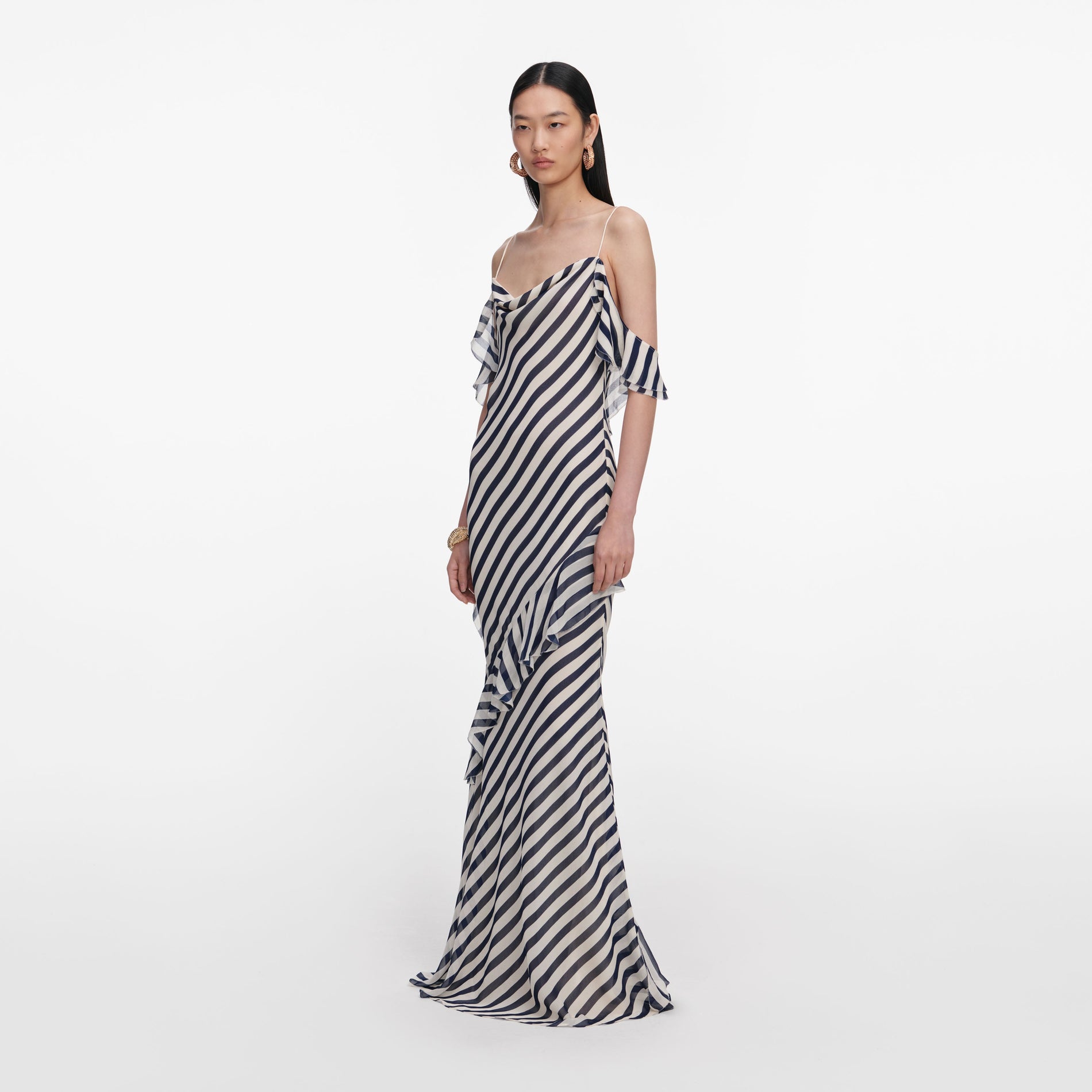 Side view of a woman wearing the Navy Stripe Georgette Maxi Dress