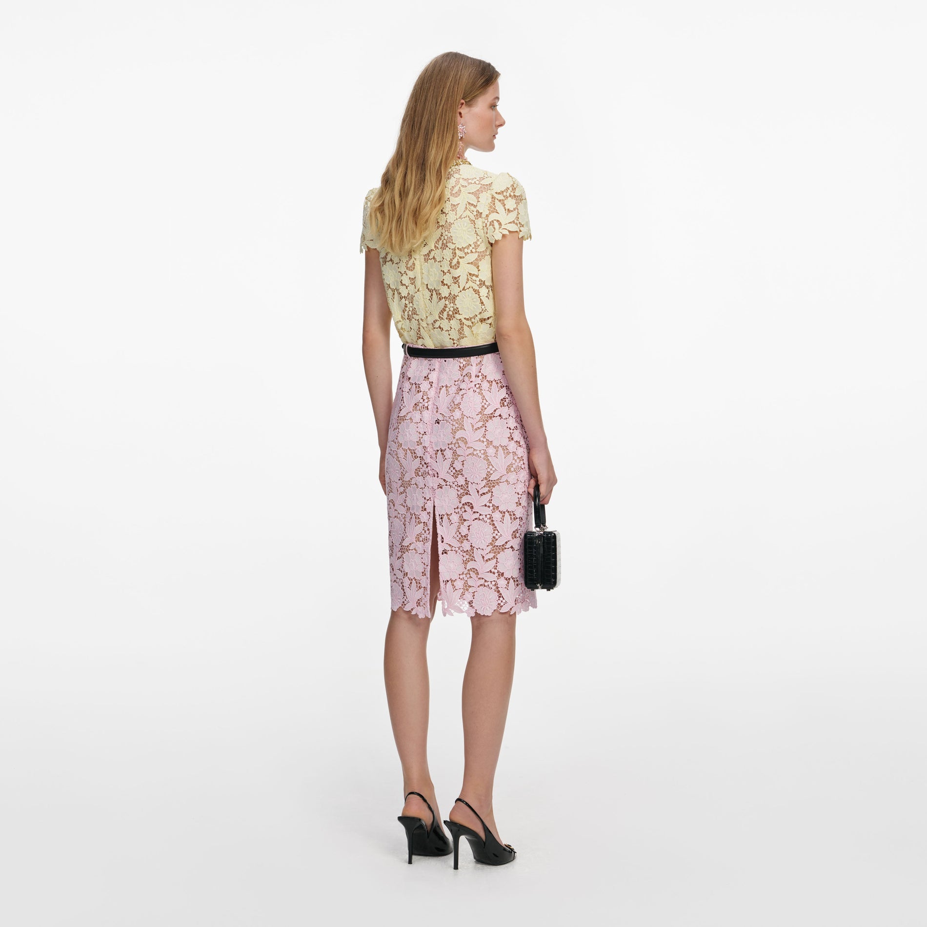 Back view of a woman wearing the Pink Lace Midi Skirt