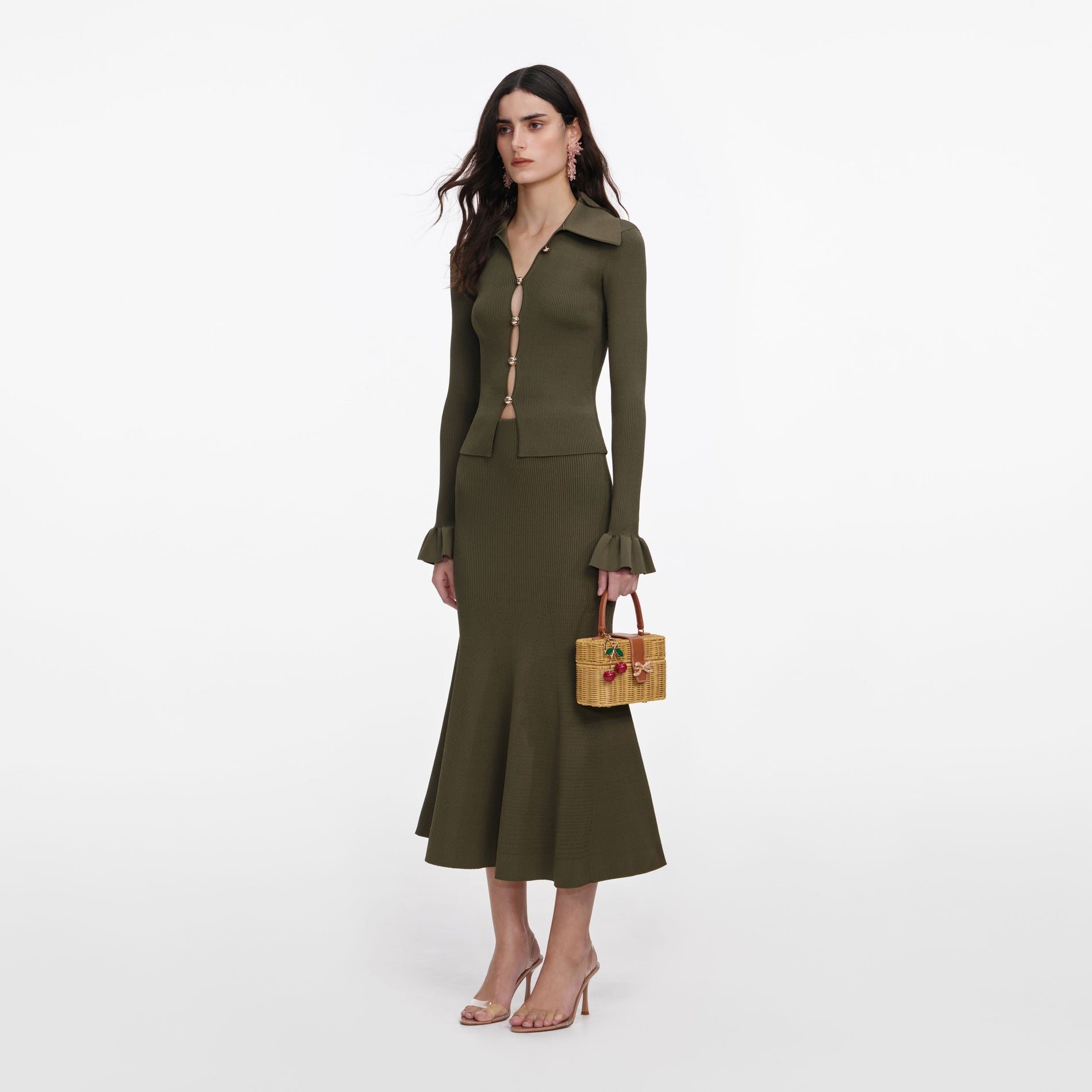 Side view of a woman wearing the Khaki Knit Midi Skirt