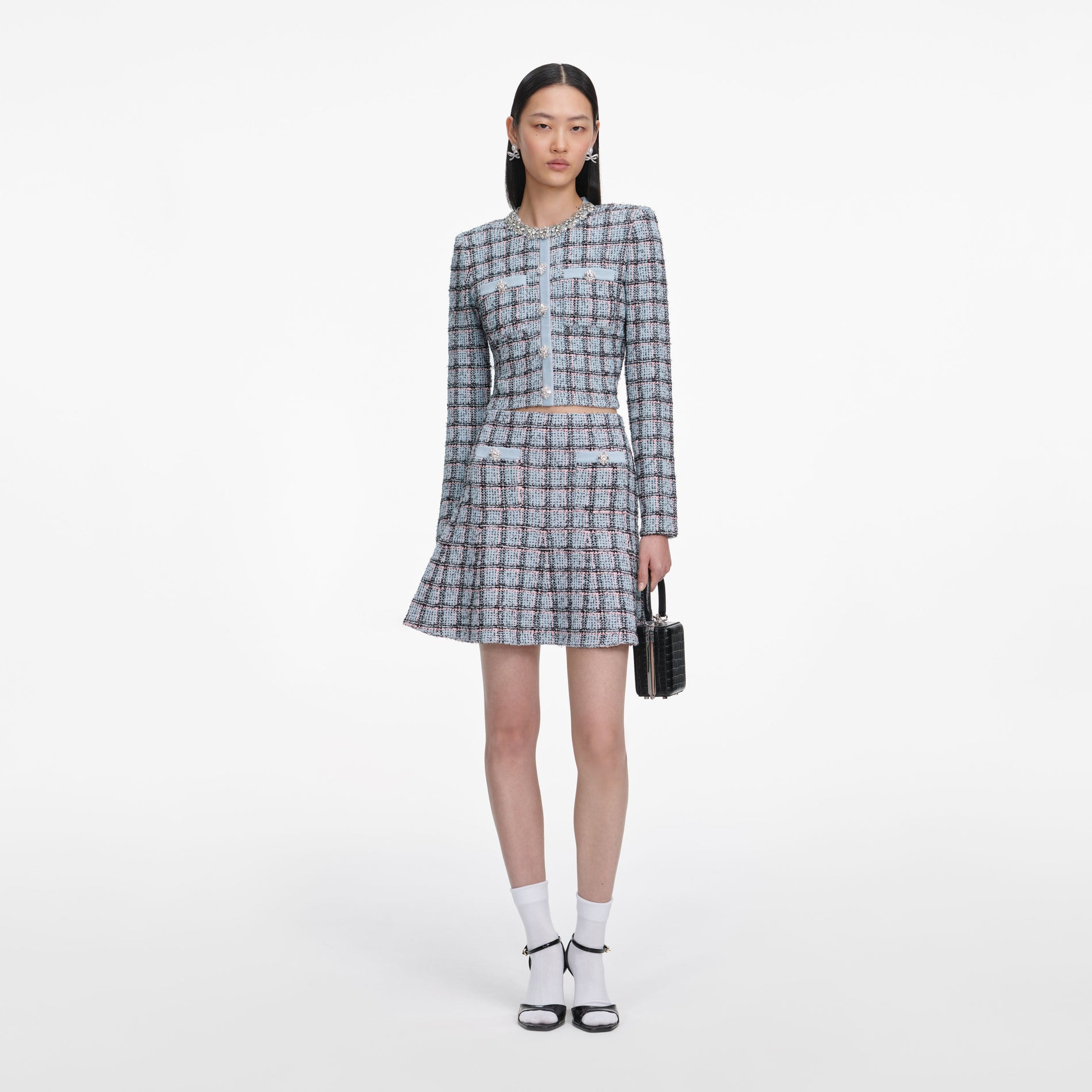 Front view of a woman wearing the Blue Check Knit Cardigan