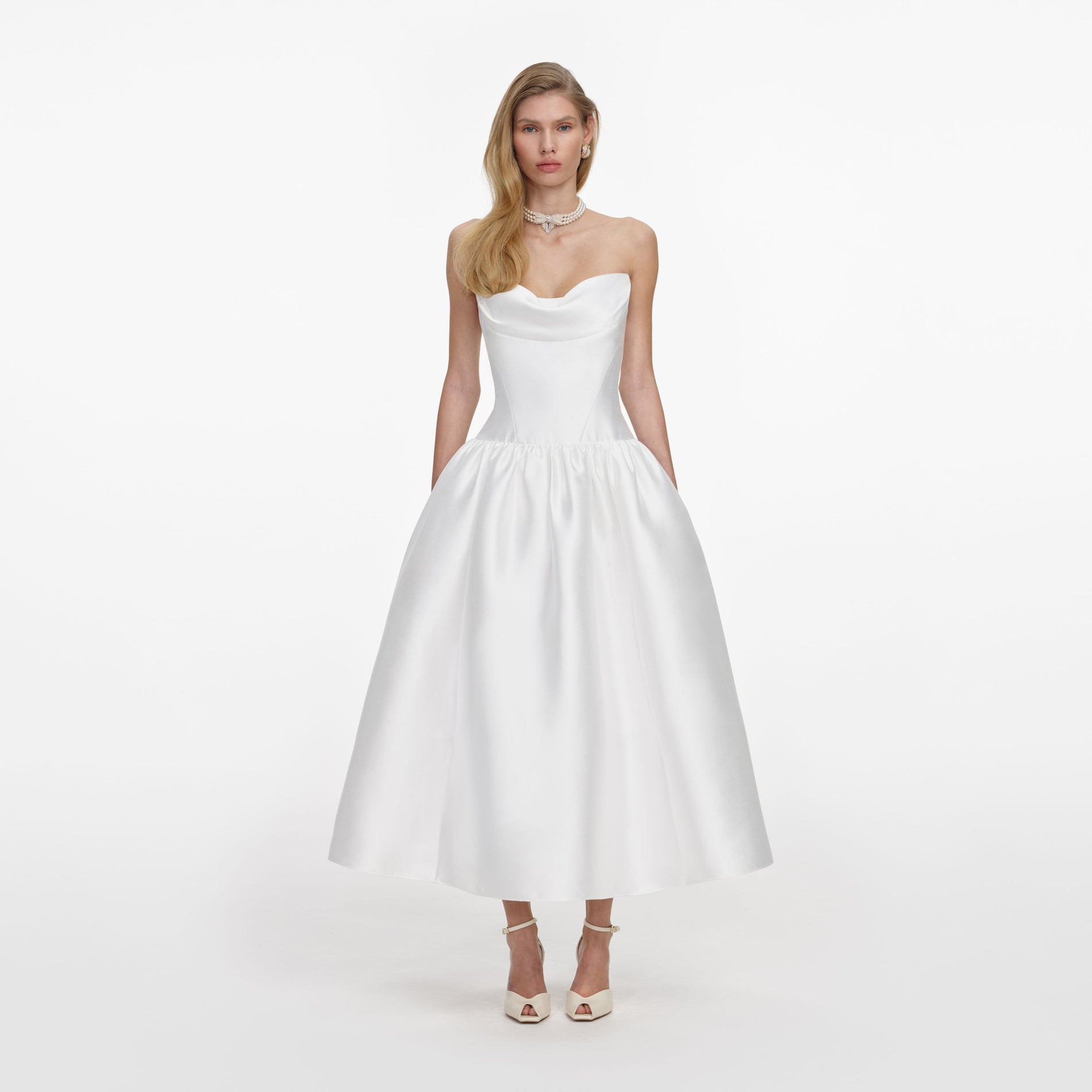 Front view of a woman wearing the White Taffeta Strapless Midi Dress