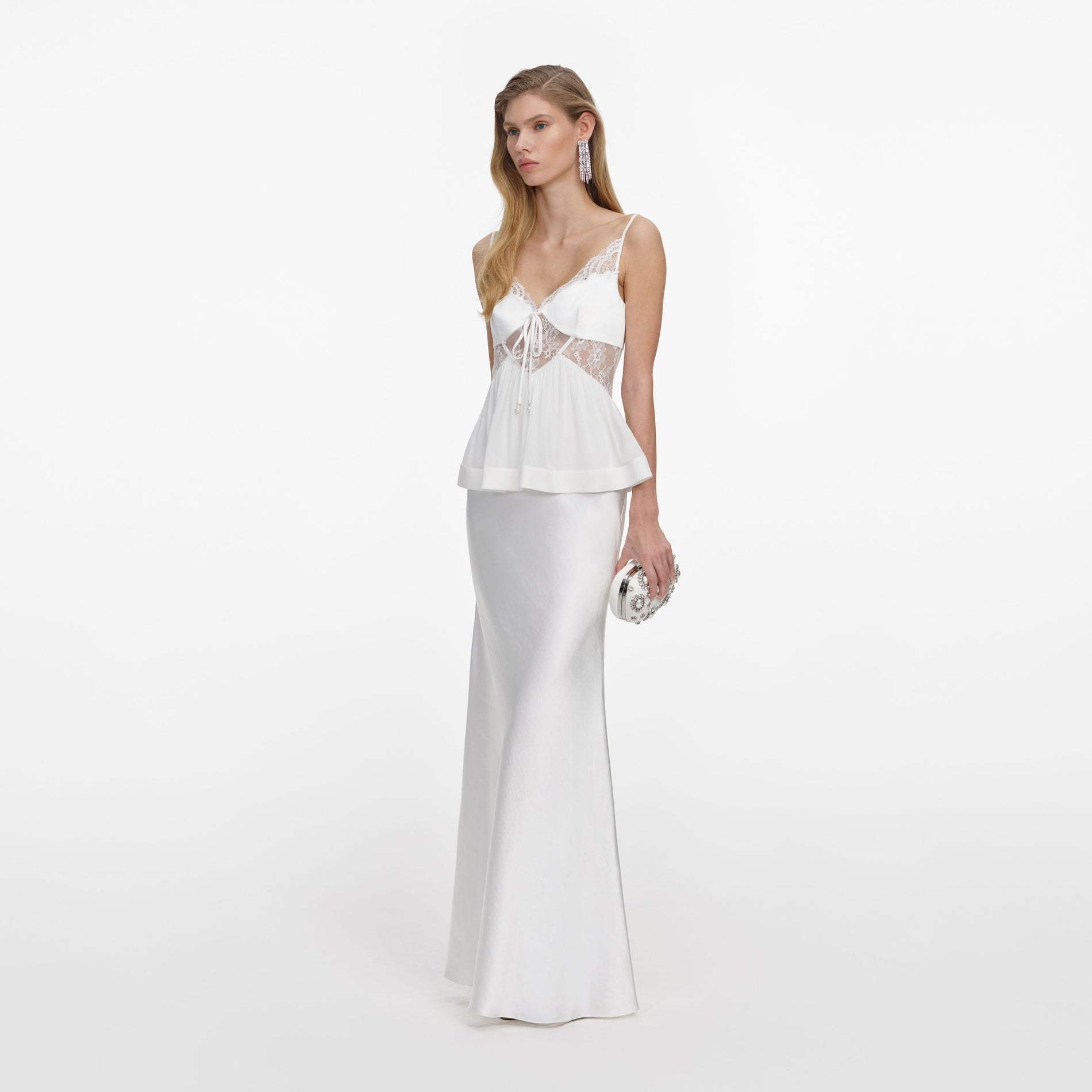 Side view of a woman wearing the White Georgette Satin Maxi Dress