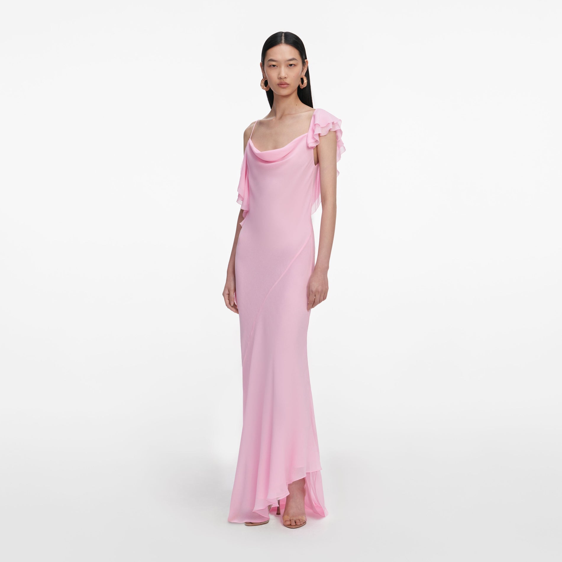 Side view of a woman wearing the Pink Georgette Frill Maxi Dress