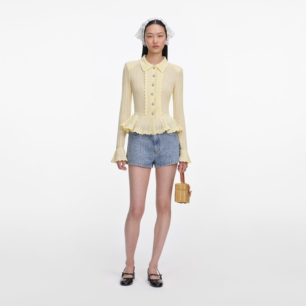 Front view of a woman wearing the Rhinestone Croc Effect Denim Shorts