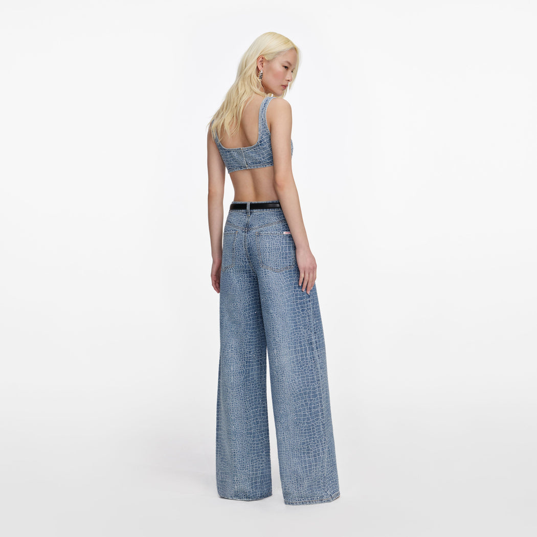Back view of a woman wearing the Rhinestone Croc Effect Denim Bralette