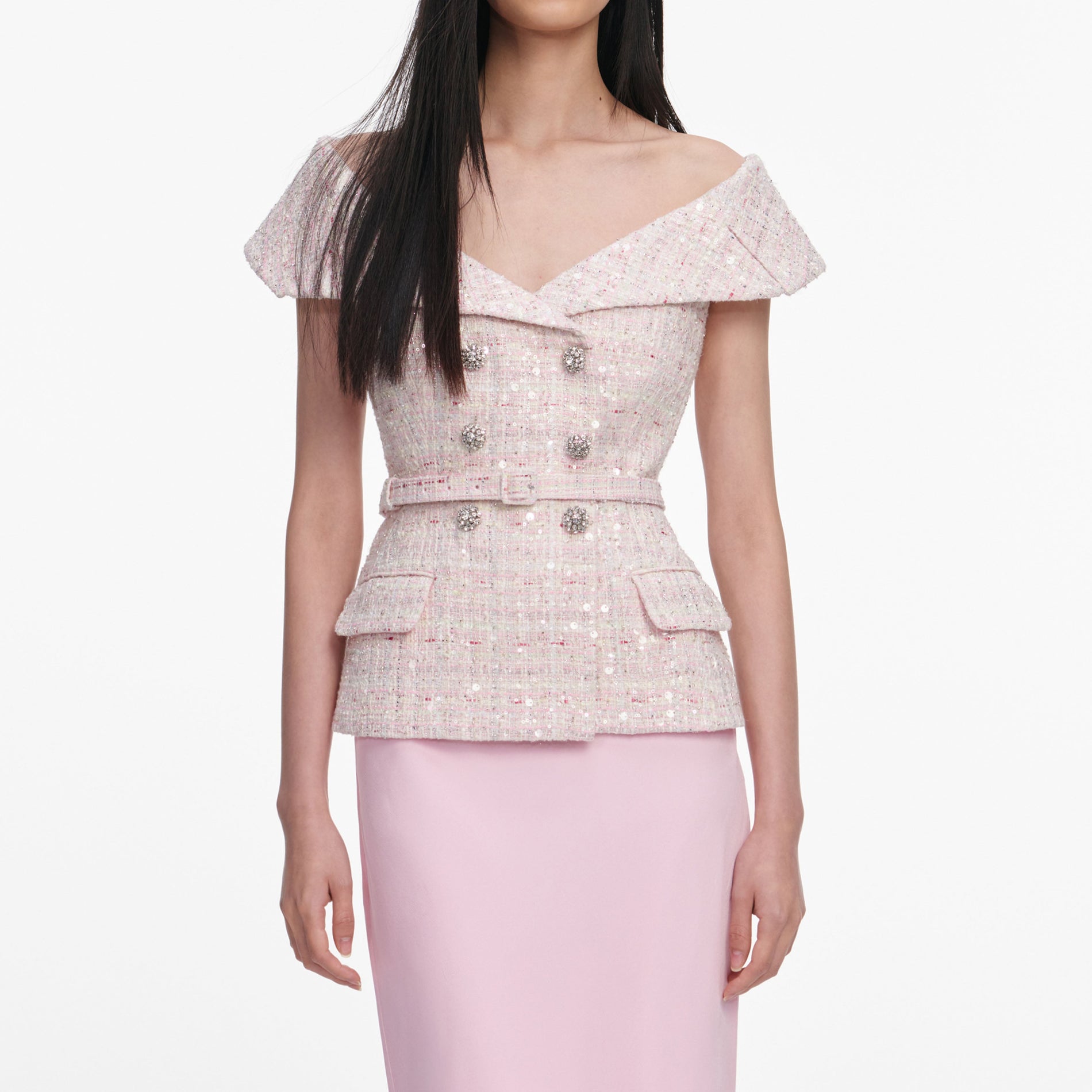 A close up of a woman wearing the Pink Sequin Boucle Maxi Dress