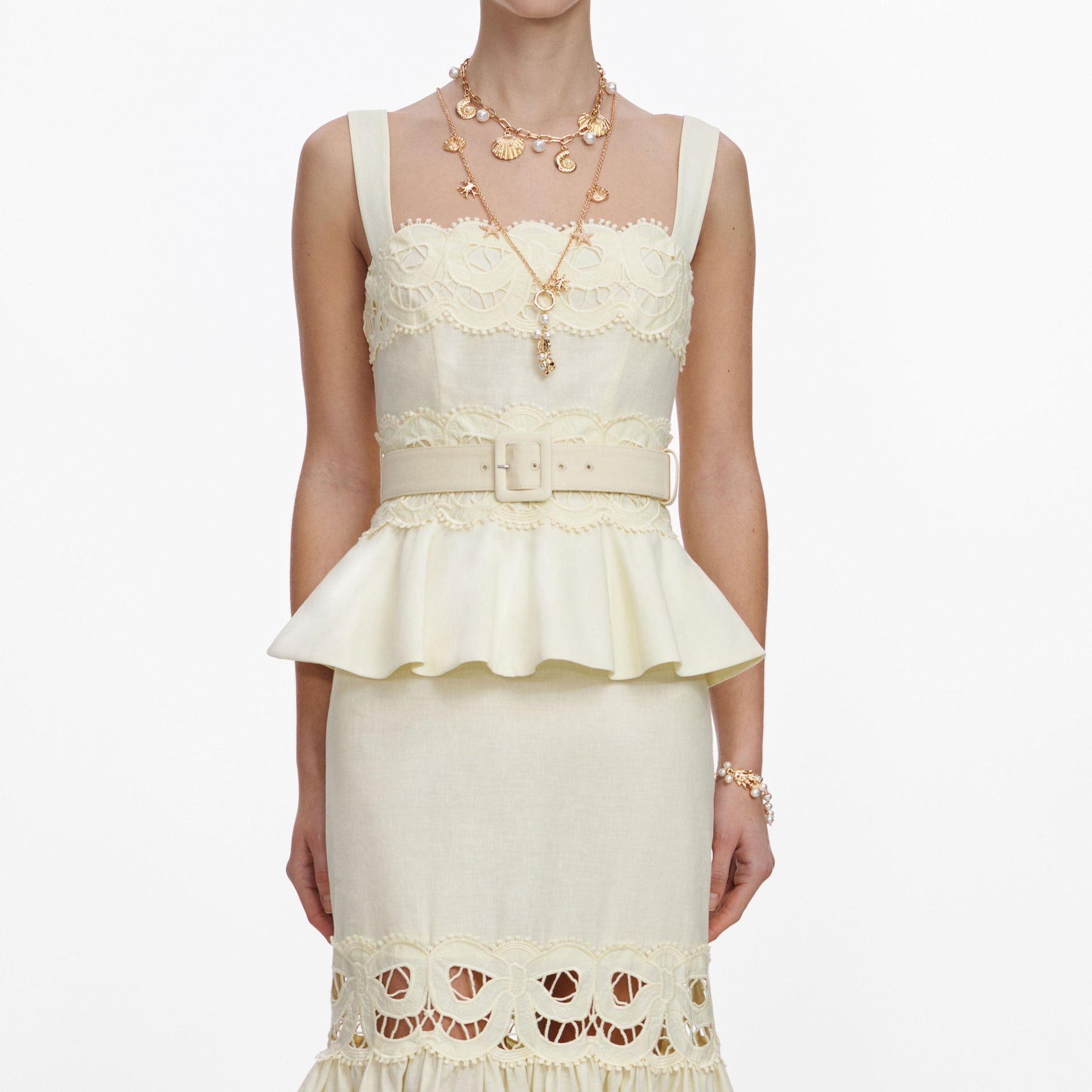 A close up of a woman wearing the Yellow Linen Peplum Midi Dress