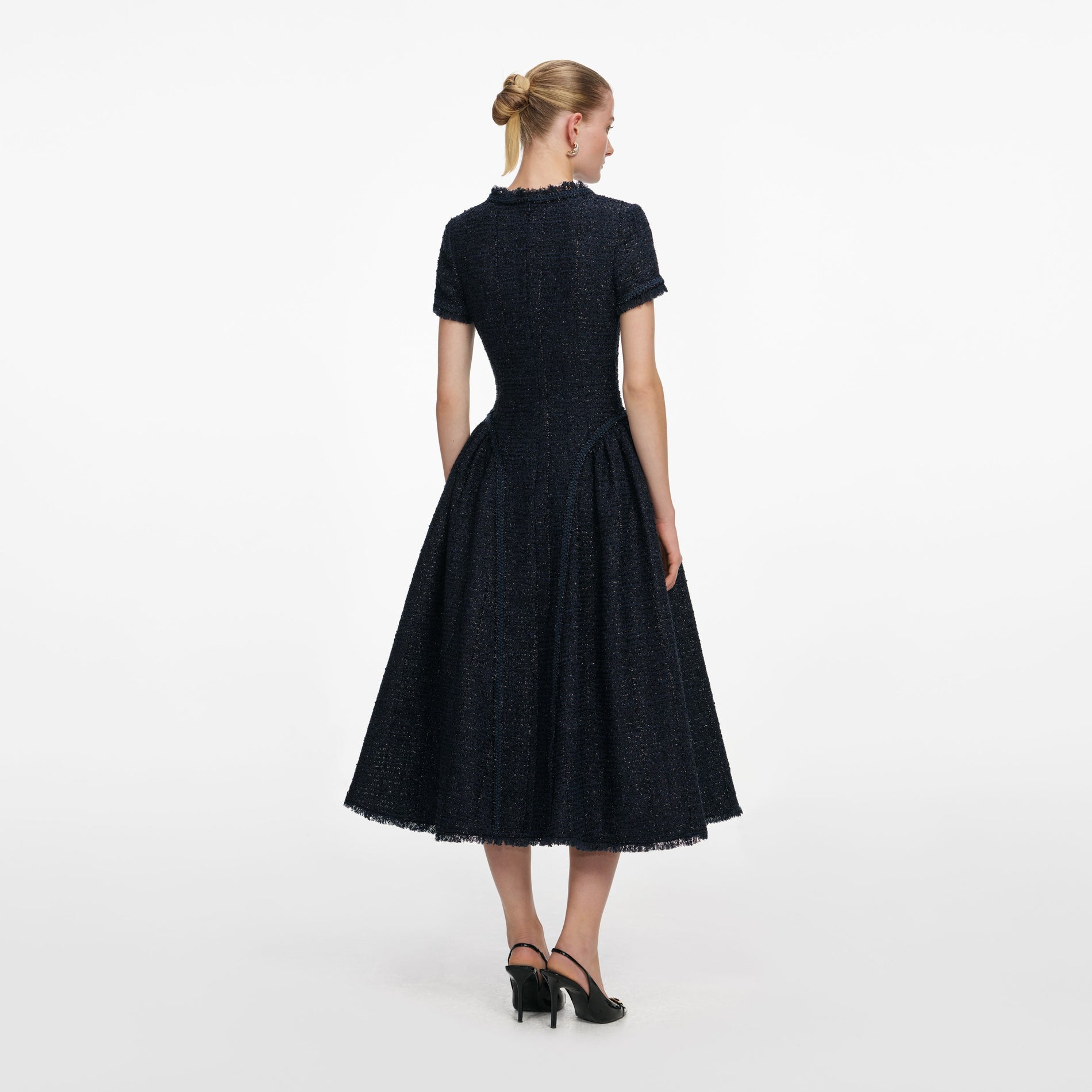 Back view of a woman wearing the Navy Metallic Boucle Midi Dress