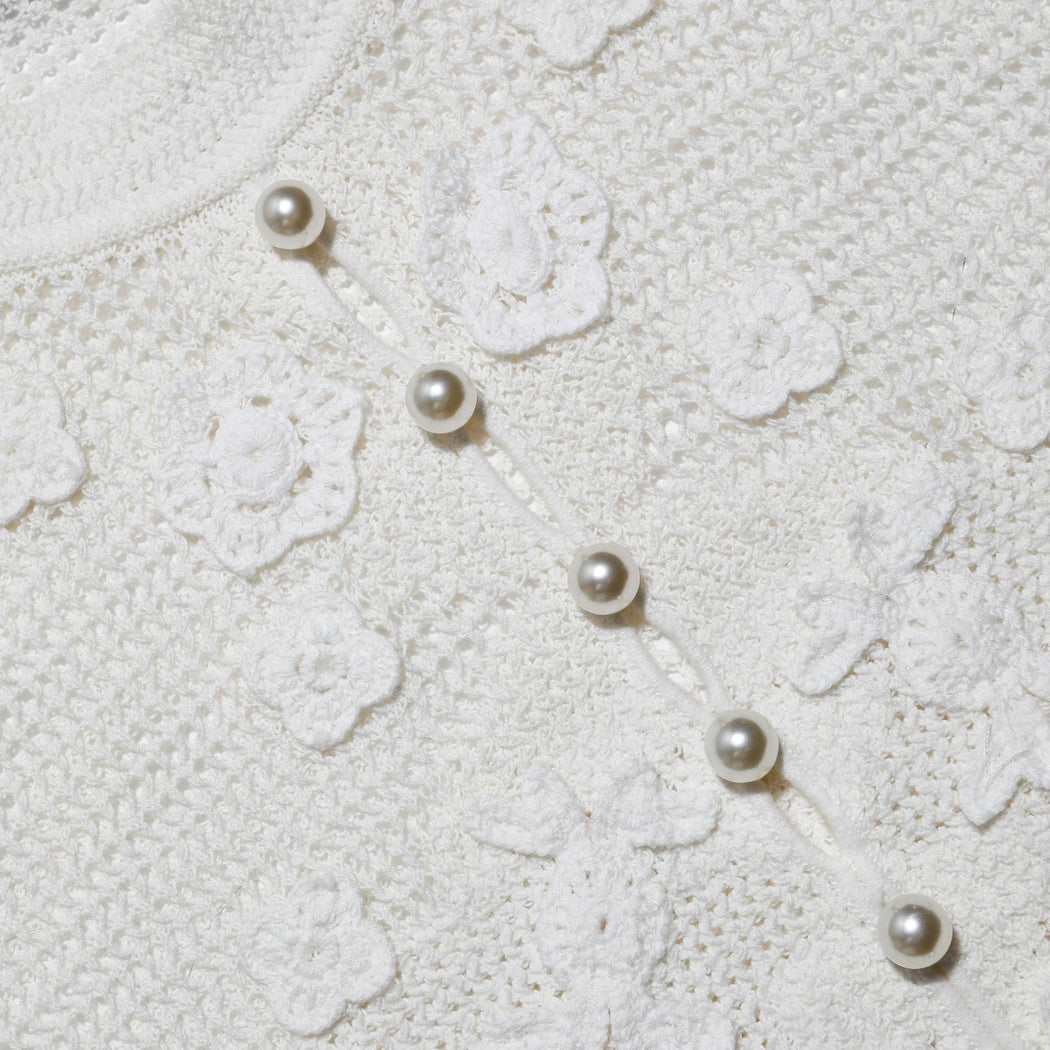 A close up of the fabric for the White Floral Crochet Top
