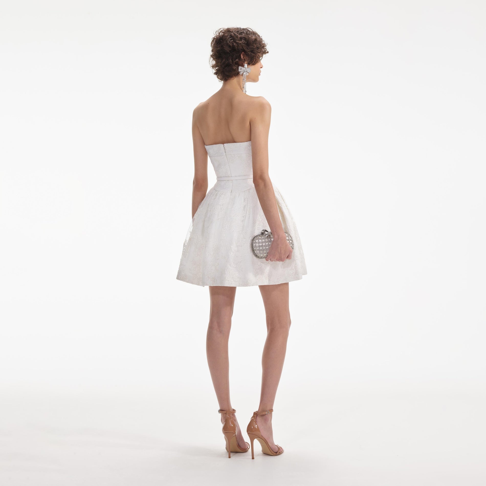 Back view of a woman wearing the Cream Lace Bandeau Mini Dress