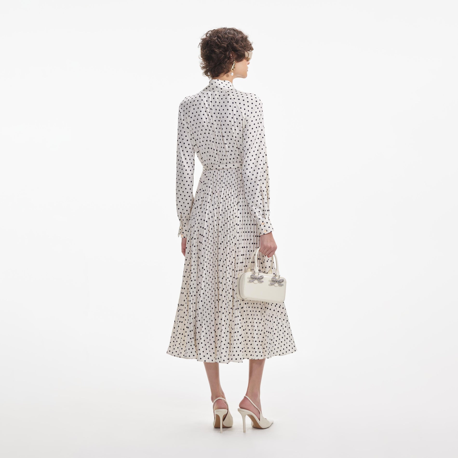 Back view of a woman wearing the White Cream Polka Dot Satin Midi Dress