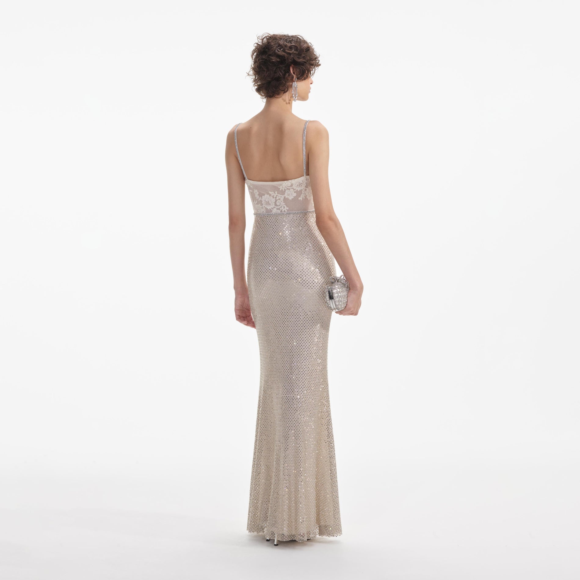 Back view of a woman wearing the White Cream Rhinestone Mesh Maxi Dress