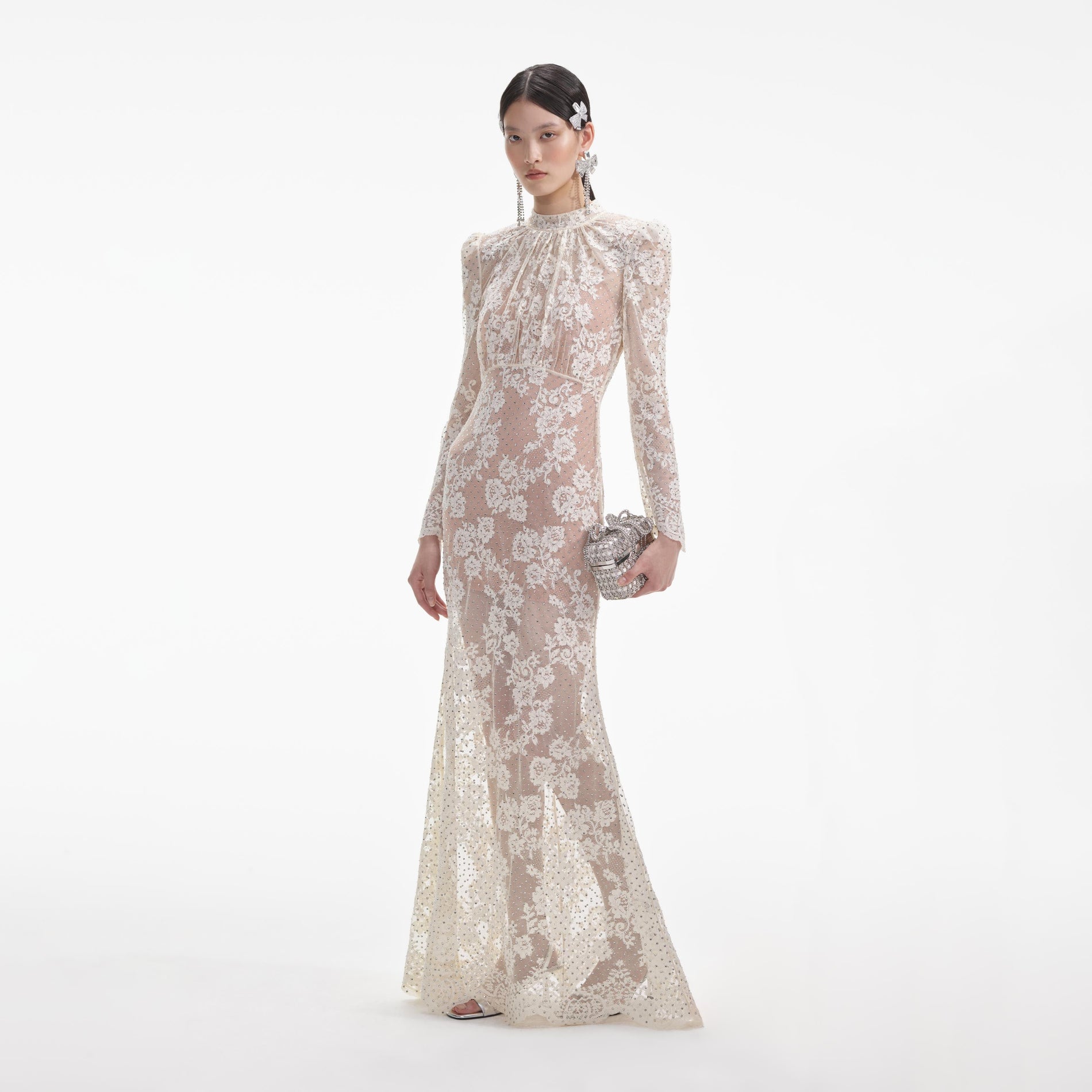 Side view of a woman wearing the White Rhinestone Lace Maxi Dress