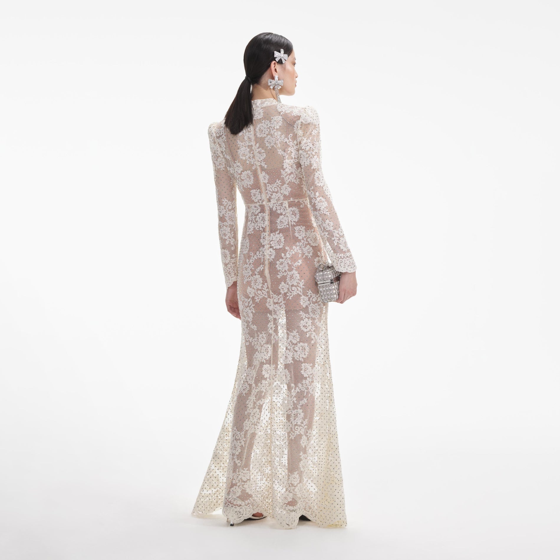 Back view of a woman wearing the White White Rhinestone Lace Maxi Dress